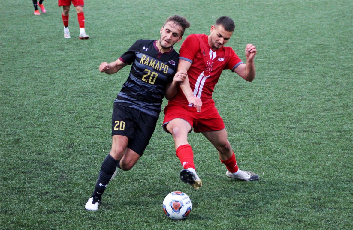 Two players from Montclair State and Ramapo battle over the ball. Trevor Giesberg | The Montclarion