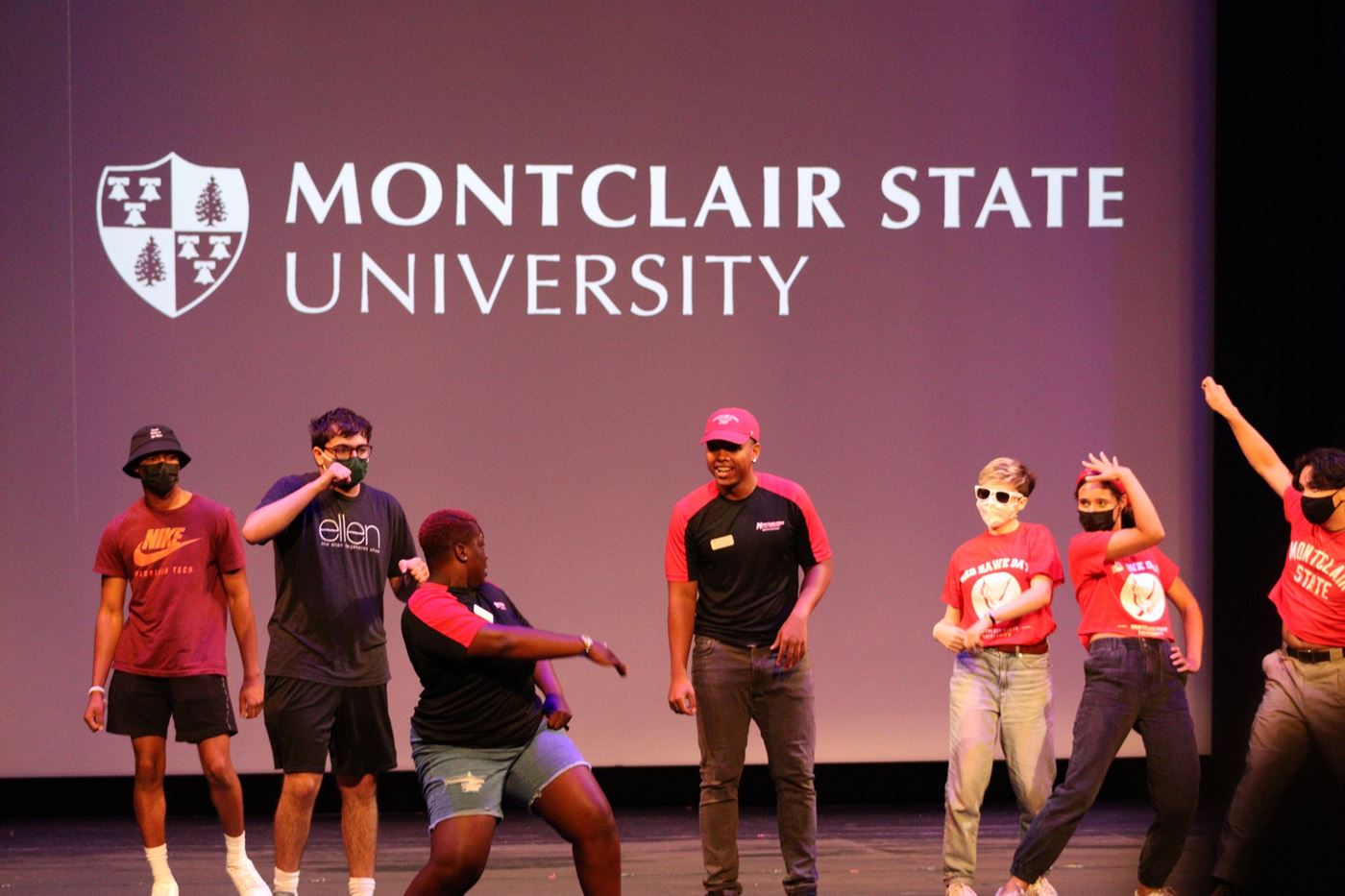 New Montclair State freshmen dancing on the stage of the Memorial Auditorium. John LaRosa | The Montclarion