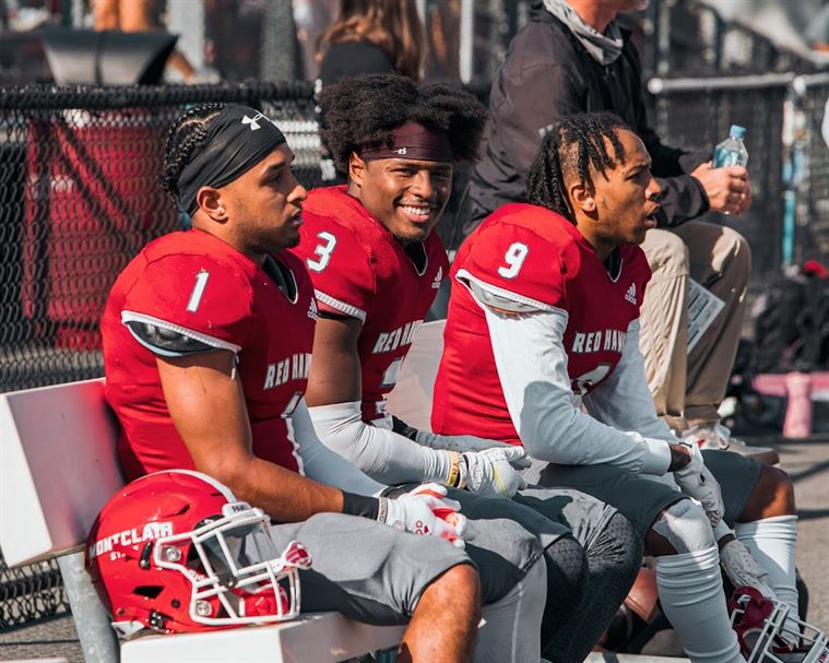 Running back coach John Straniero said Mickens (center) always has a smile on his face. Kevin Murrugarra | The Montclarion
