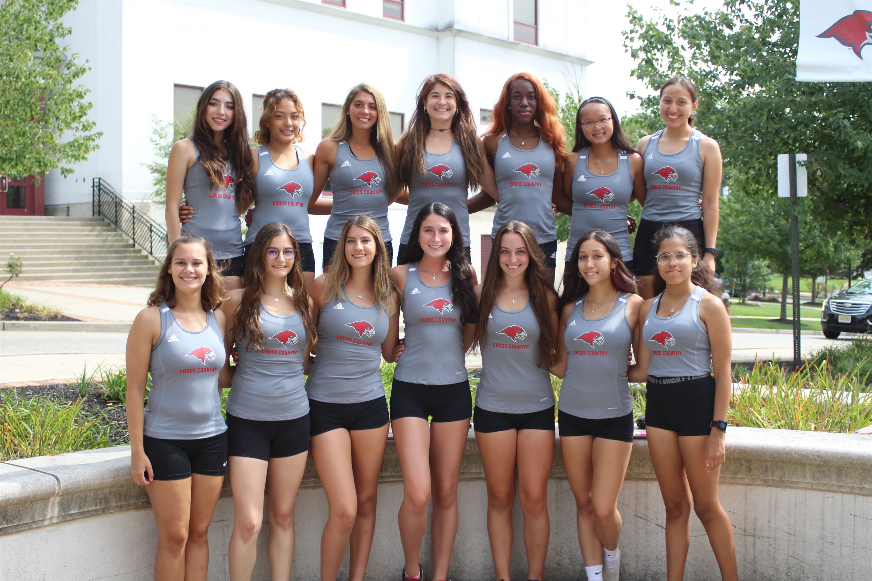 The 2021 women's cross country team poses for a team photo during their media day.