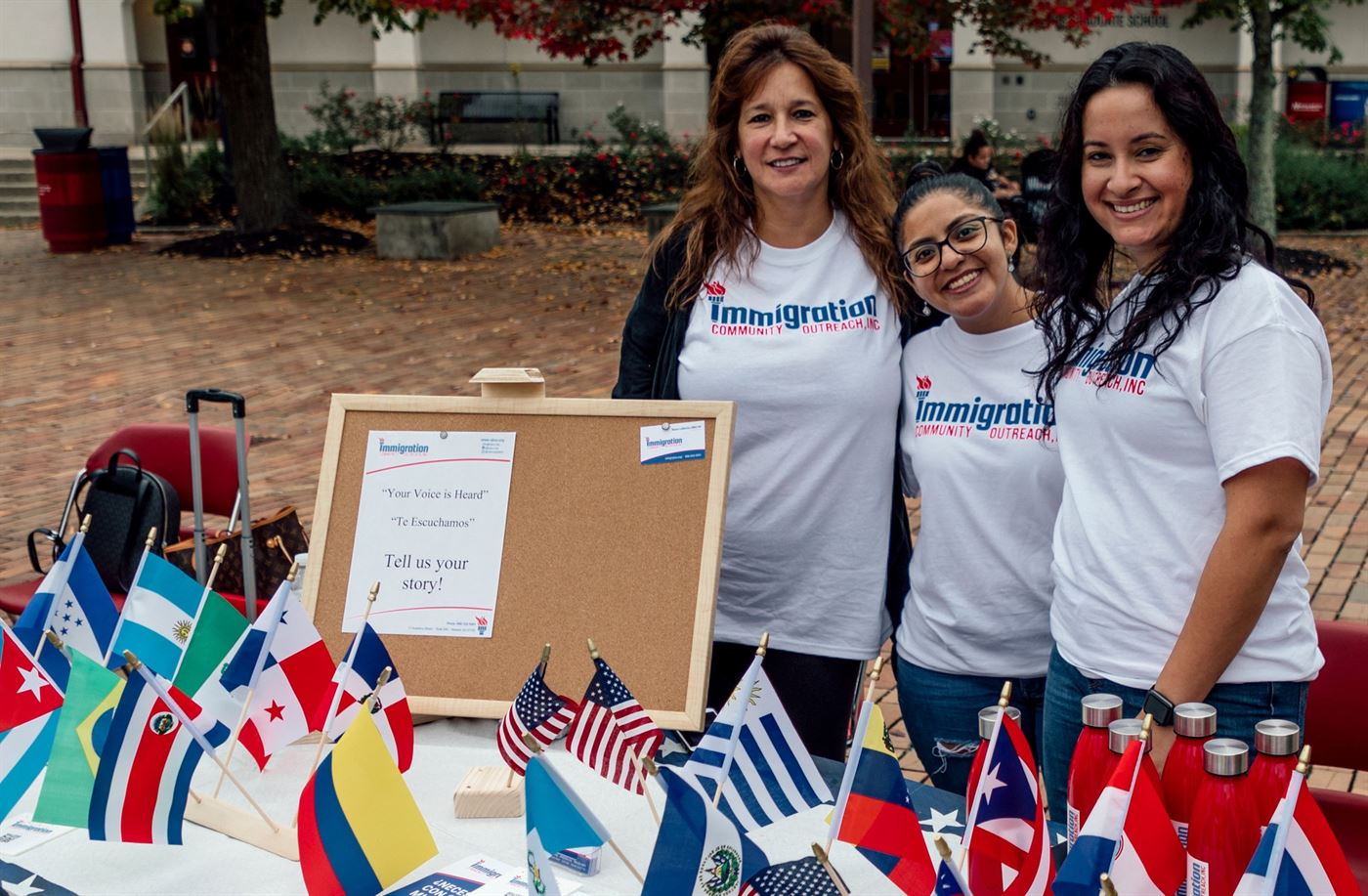 Members of Immigration Community Outreach, Daniela, Deloris and Mayra, at the Student Center Quad. Photo courtesy of Karsten Englander