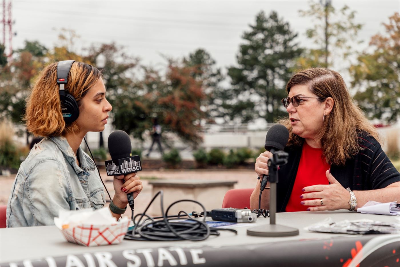 News director of WMSC, Anandaji Cruz Rosario (left), interviewing Dr. Katia Paz Goldfarb (right) about the block party. Photo courtesy of Karsten Englander