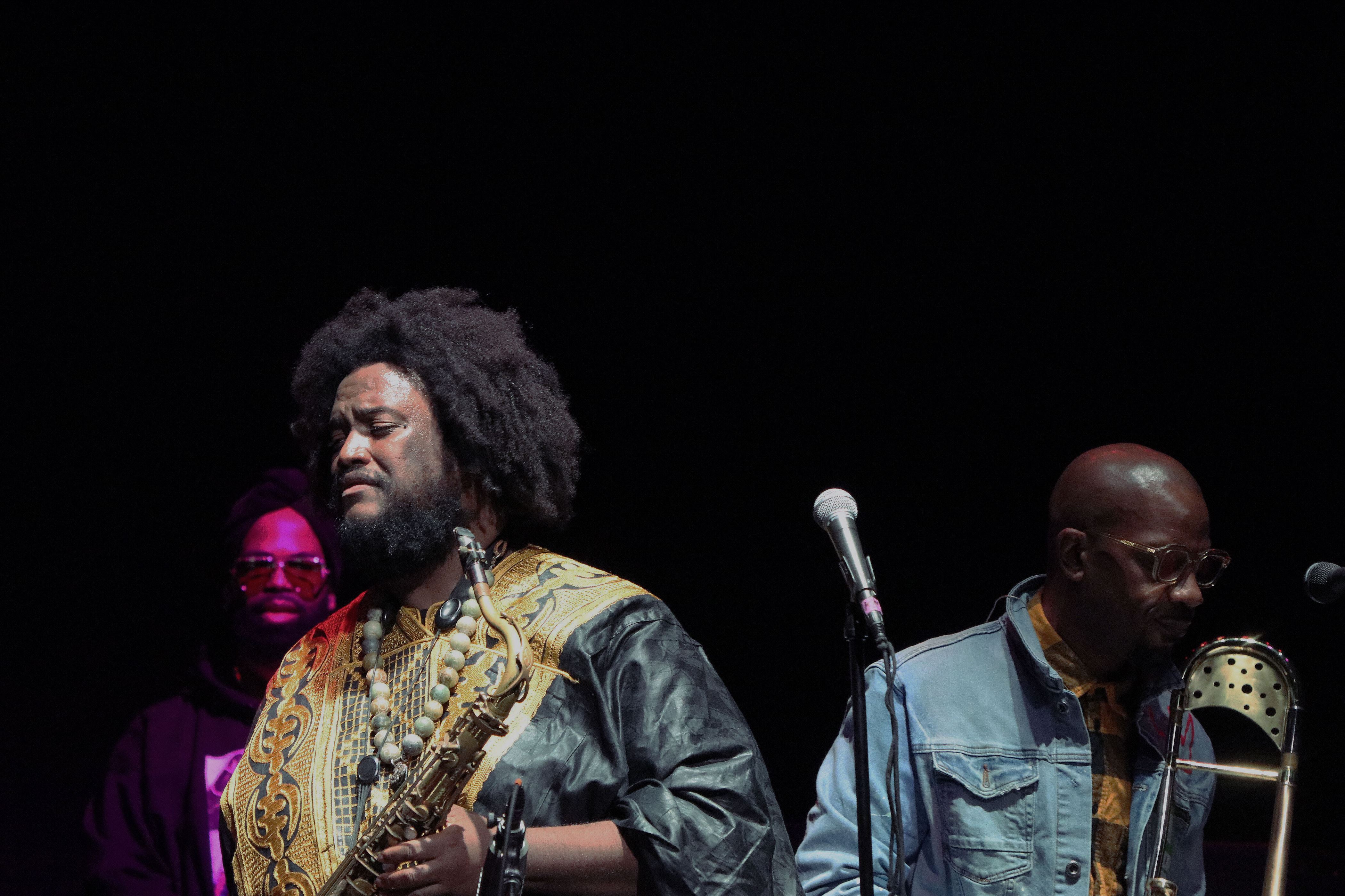 Kamasi Washington and trombonist Ryan Porter between solos with DJ Battlecat in the background. Photo courtesy of Julian Rigg