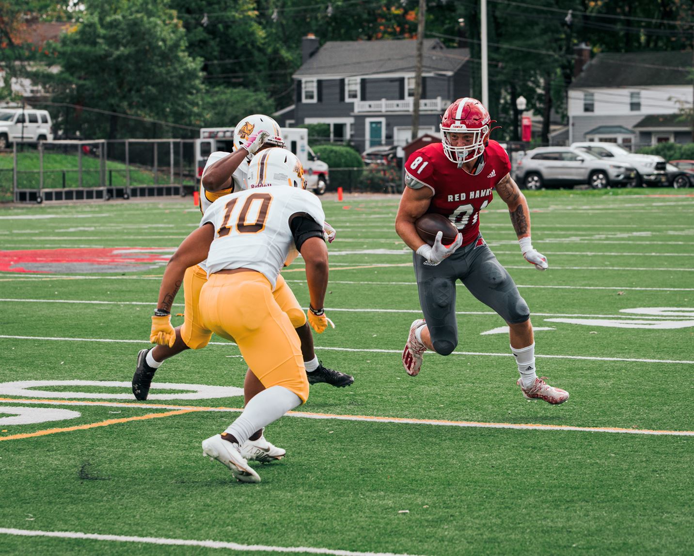 Sophomore tight end Eric Cowan tries to get past two Rowan University defenders. Kevin Murrugarra | The Montclarion