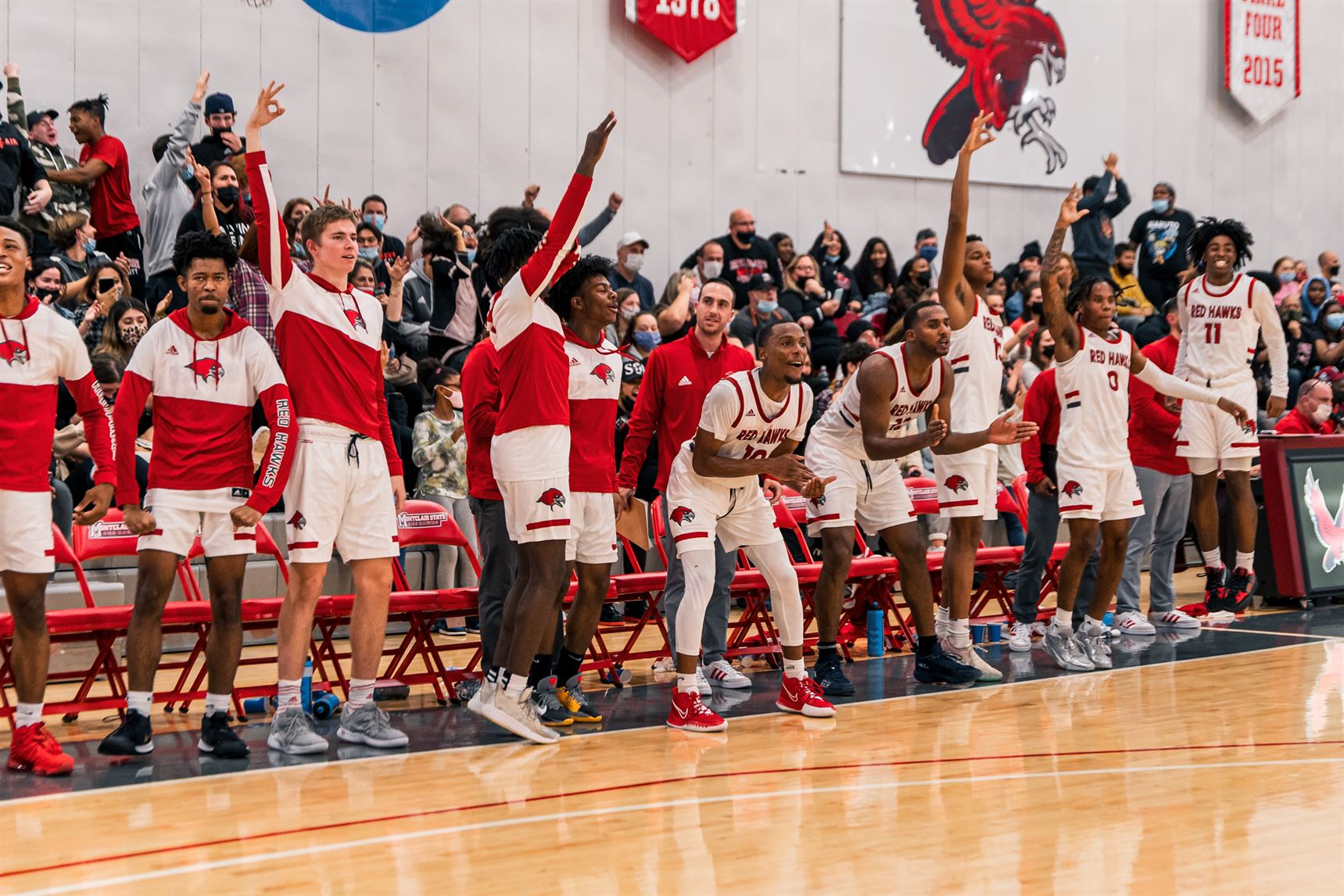 The Red Hawk bench celebrates a big play. Kevin Murrugarra | The Montclarion