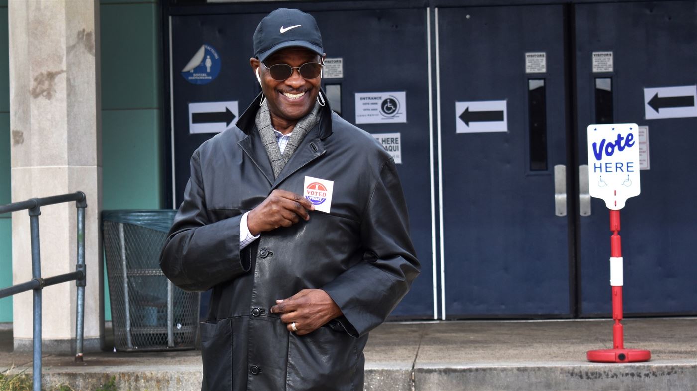 A Hackensack voter flashes a quick smile after exiting the polling station at Hackensack High School. Photo courtesy of Courtney White