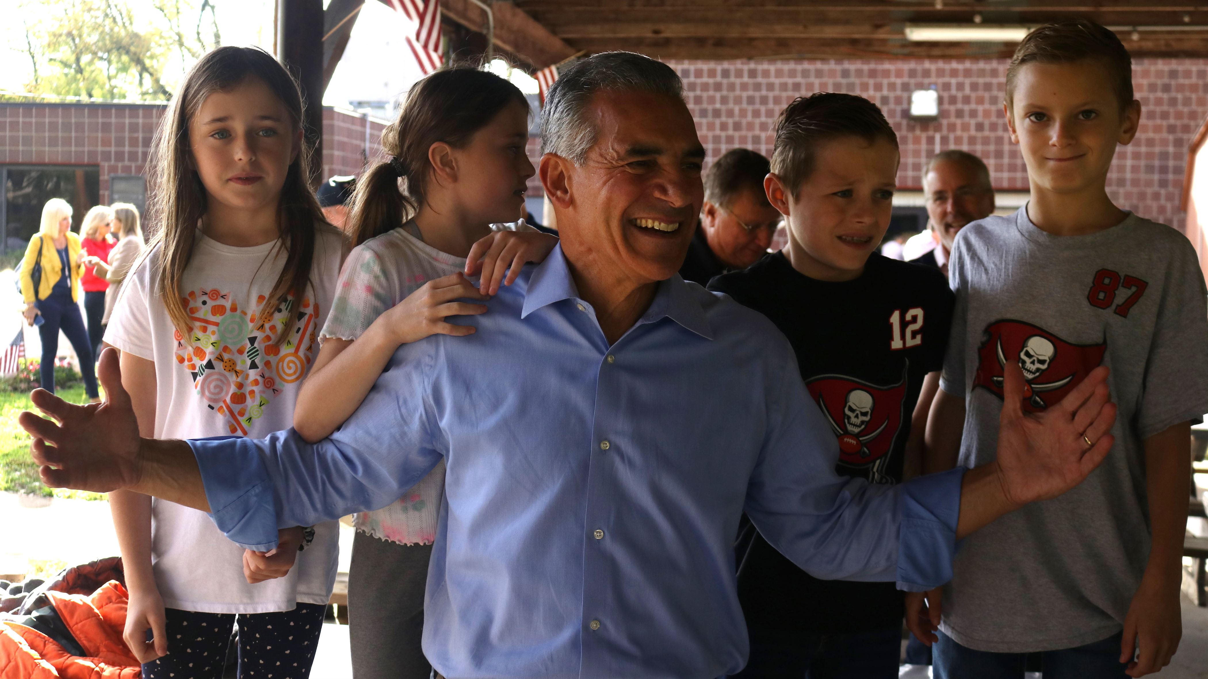 Republican gubernatorial candidate Jack Ciattarelli poses for photos with children in Morris Plains, New Jersey. Francis Churchill | The Montclarion
