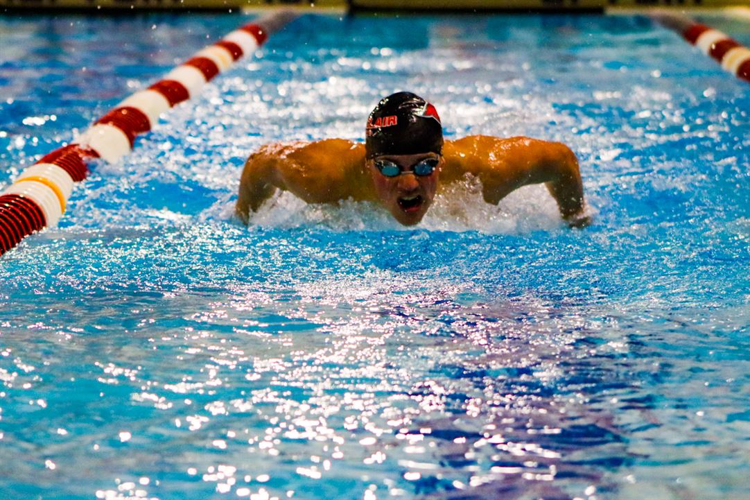 A Montclair State University male swimmer competes in a race. Trevor Giesberg | The Montclarion