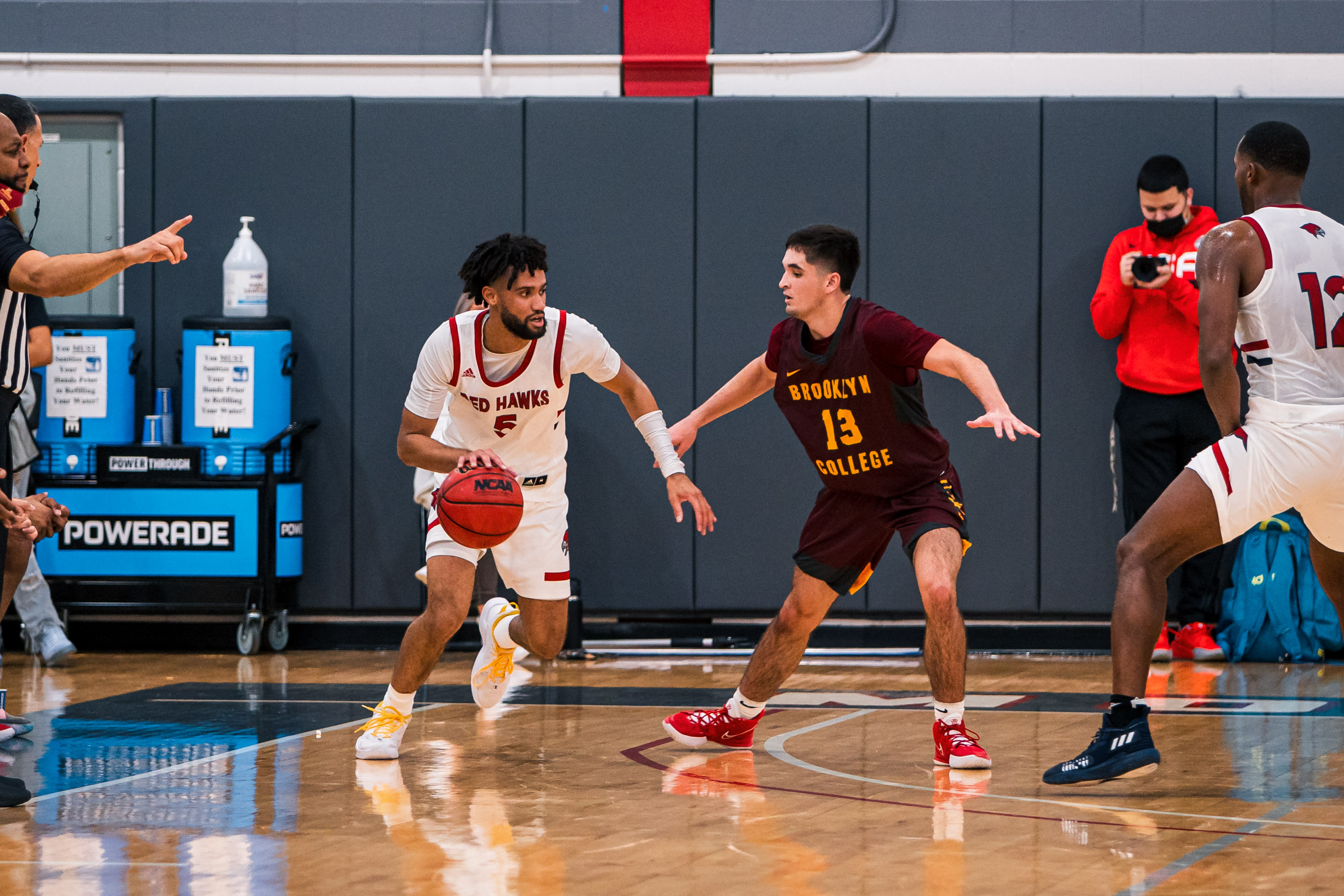 Callender IV tries to drive past the three-point line during the team's 2021 home opener against Brooklyn College. Kevin Murrugarra | The Montclarion