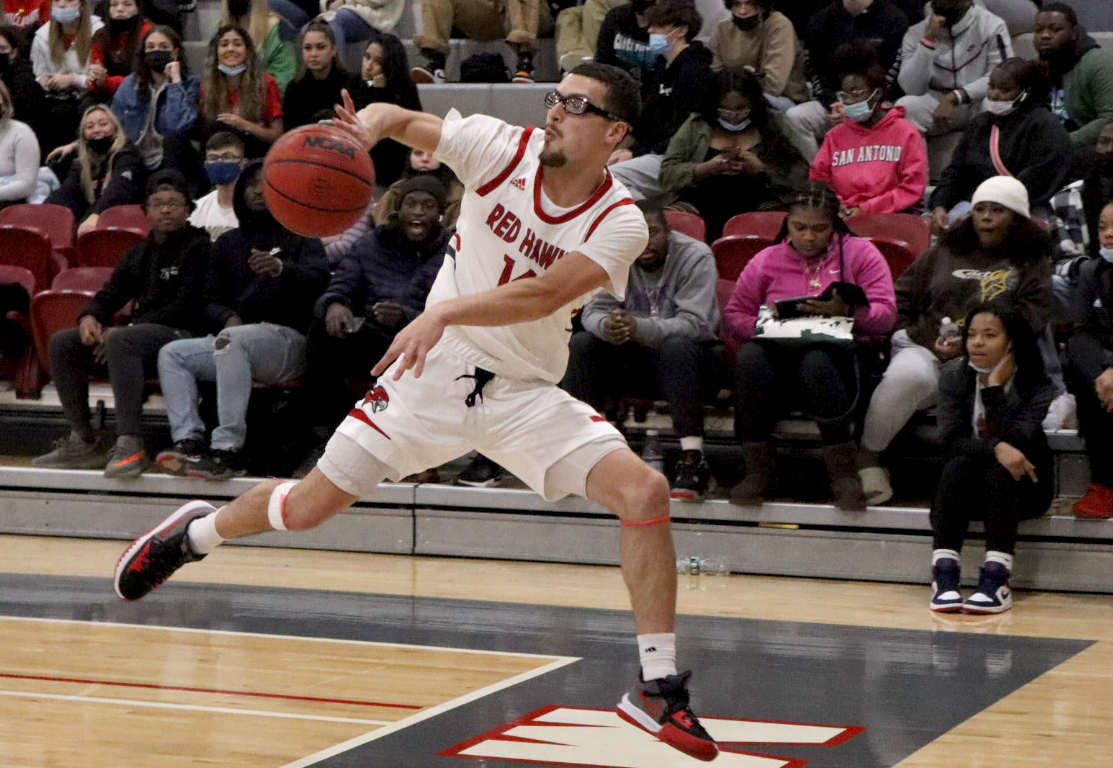 Junior guard Greg Eck saves the basketball from going out of bounds. Trevor Giesberg | The Montclarion
