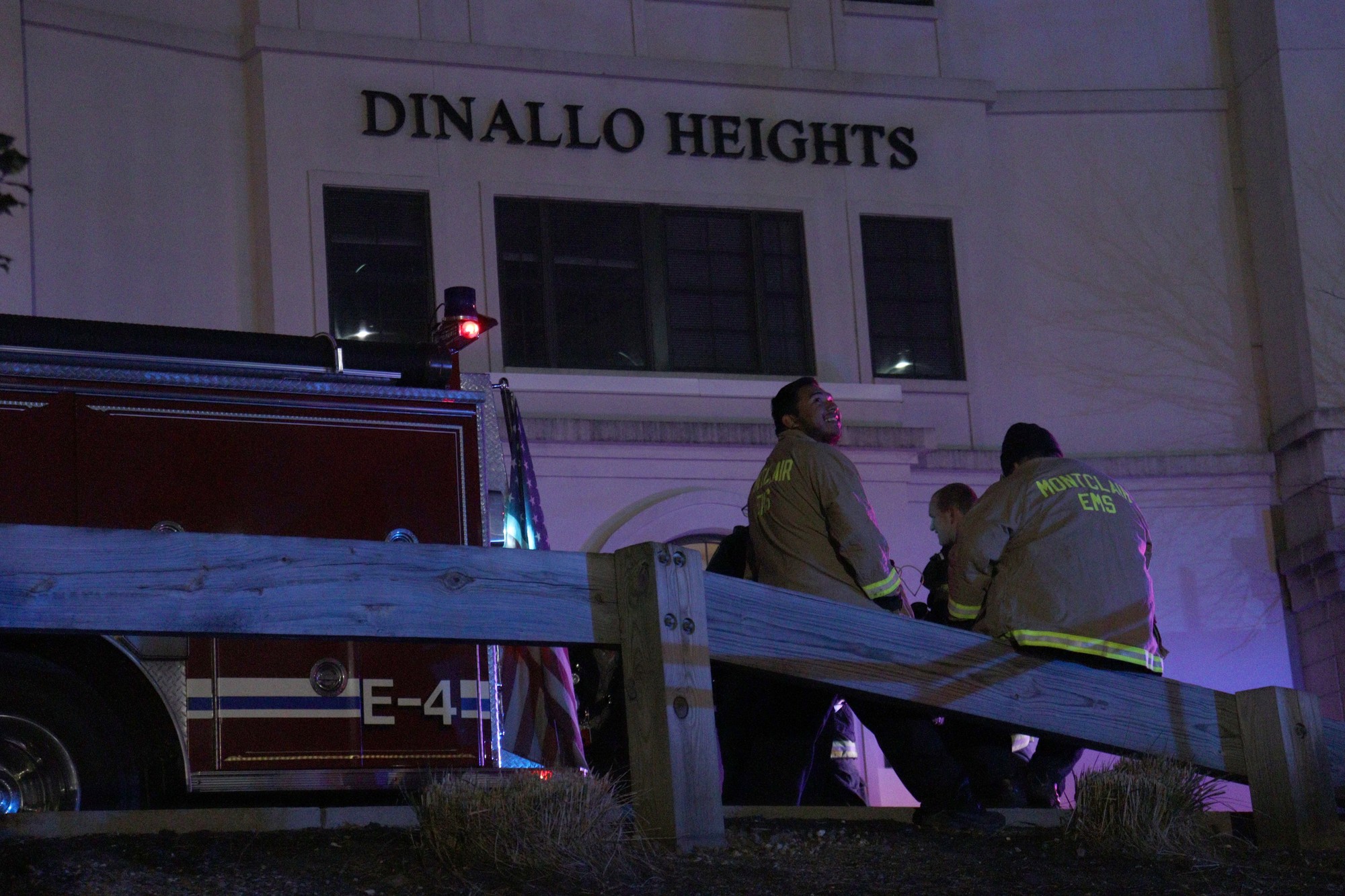 Montclair Emergency Medical Services (EMS) members waiting outside Dinallo Heights as police helped evaluate damages. John LaRosa | The Montclarion