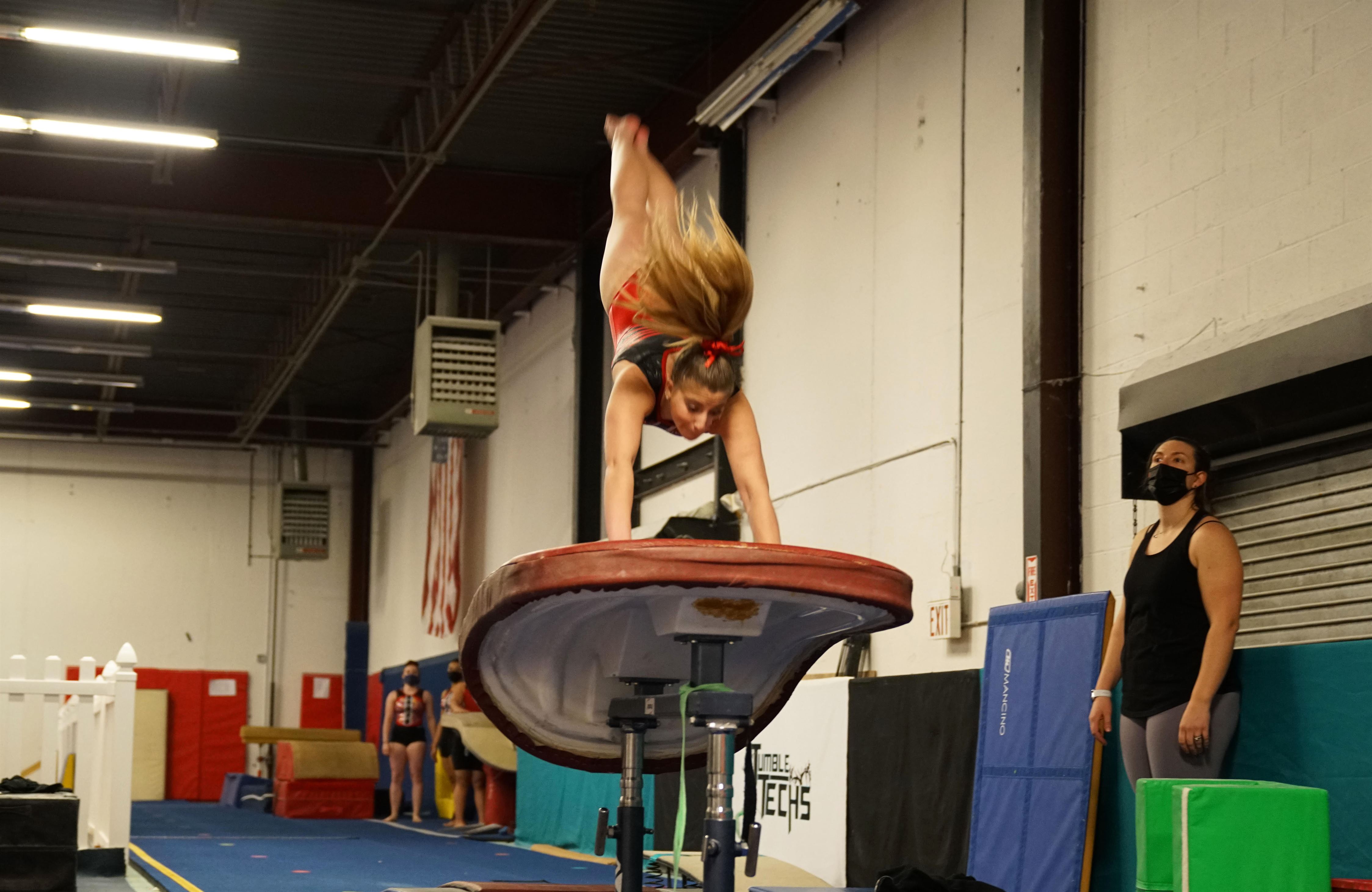 Hannah Goldhaber performs on a vault during a meet. Photo courtesy of Montclair State Club Gymnastics