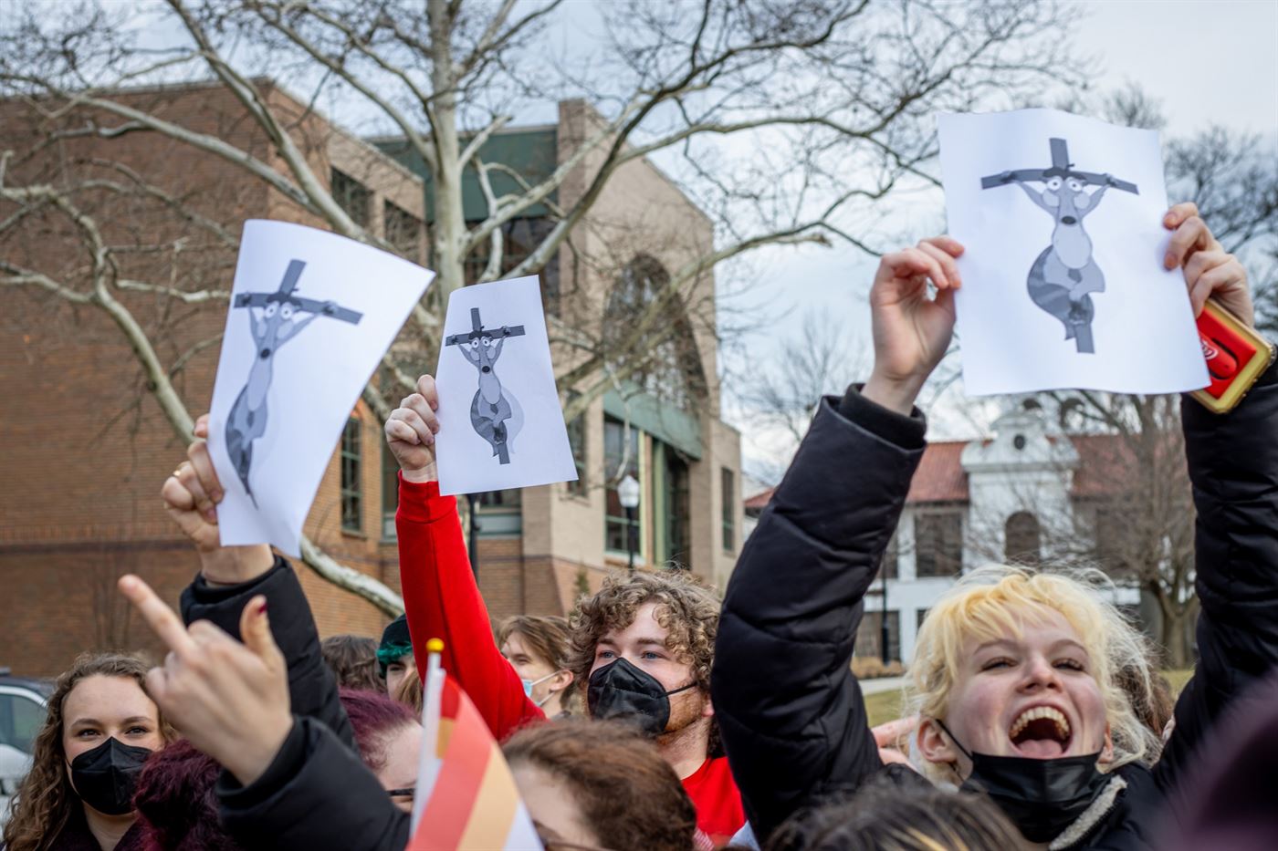 Students holding up a picture of Scrat from “Ice Age” crucified to a cross mocking Pastor Aden and the David Christian Center. John LaRosa | The Montclarion