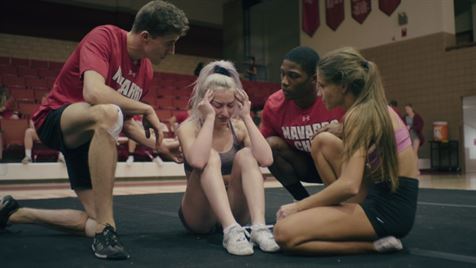 Navarro cheerleaders come together to support each other as intense training takes a toll on them. Photo courtesy of Netflix