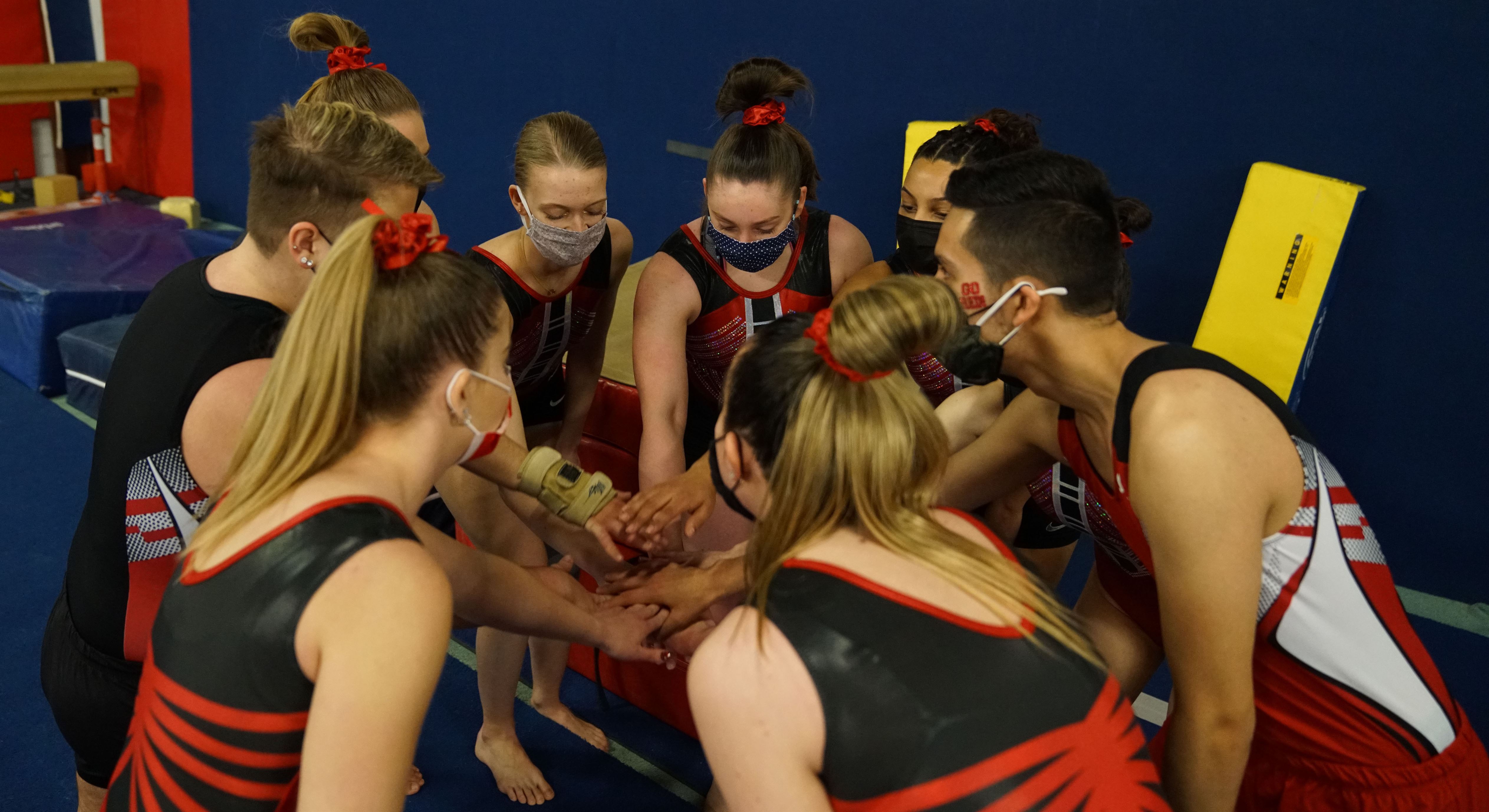Montclair State Gymnastics club comes together in a huddle during a meet last year. Photo courtesy of Montclair State Club Gymnastics