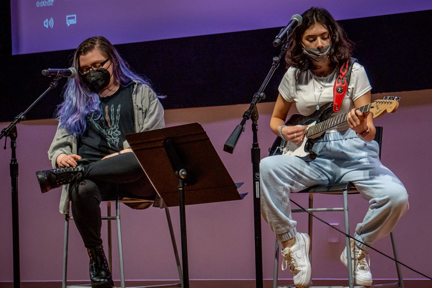 Left to right: Emily McCormack, a sophomore film and television major, sings a "Happy Hour Mashup" as Lara Ziccardi, also a sophomore film and television major, sings and plays her guitar with her. Lynise Olivacce | The Montclarion