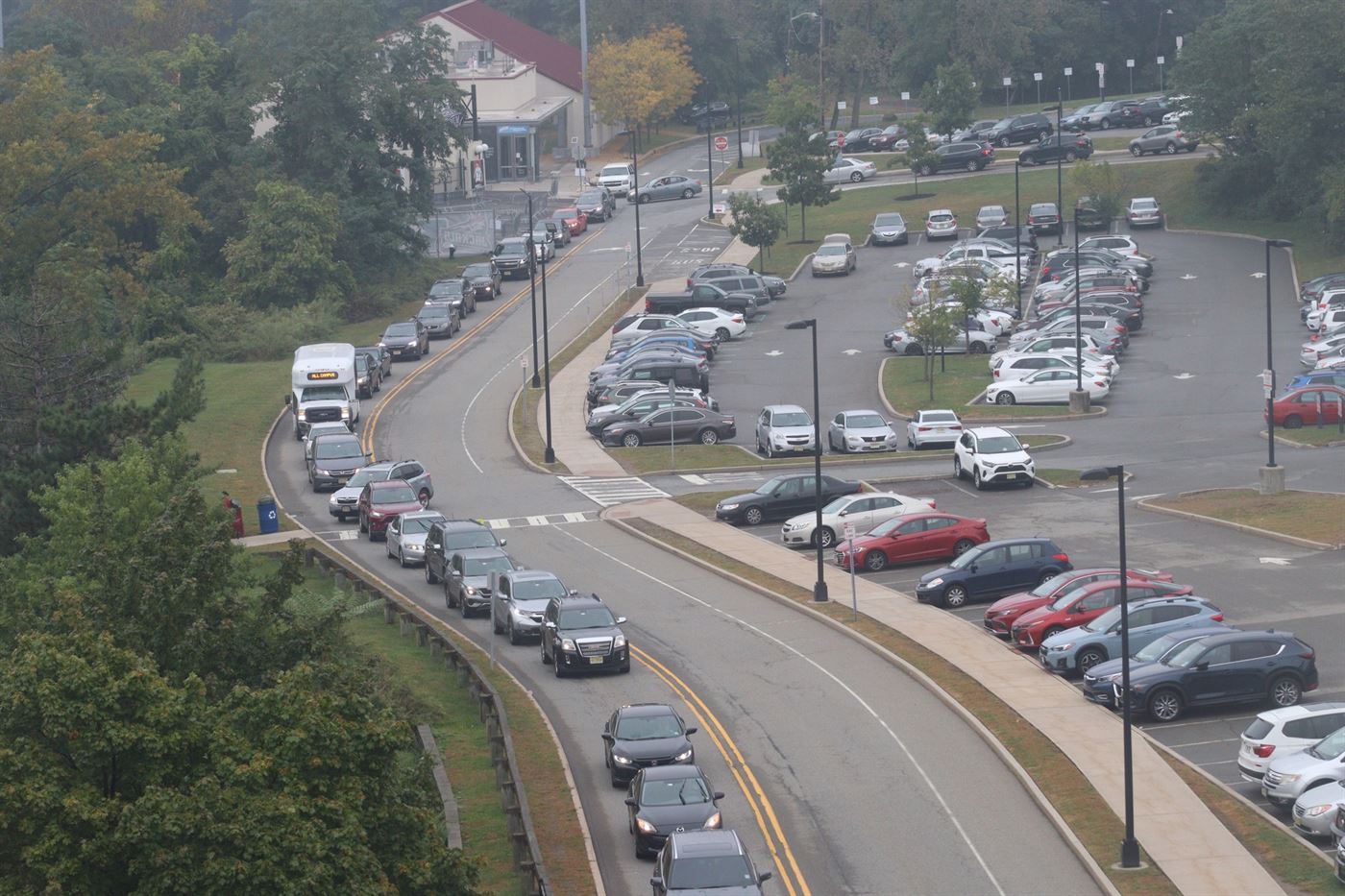 A line of cars wrapped all down Yogi Berra Drive on campus as everyone leaves through the school's only exit. John LaRosa | The Montclarion