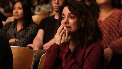 Suze (Alanna Ubach) cries as she essentially watches the tumultuous childhood her daughters, Cassie and Lexi, had. Photo courtesy of HBO
