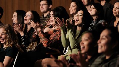Audience members, including (center) Kat (Barbie Ferreira) and Maddy (Alexa Demie), cheer as they watch Lexi's debut play. Photo courtesy of HBO