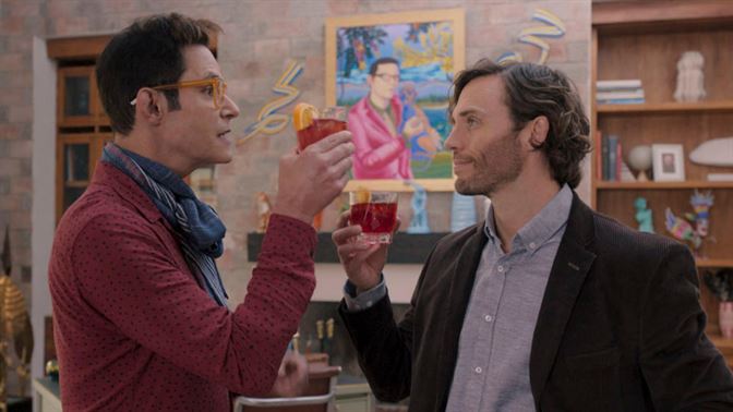 Henry celebrates his success with his publisher Pedro, played by Horacio Villalobos. Photo courtesy of Amazon Prime Video