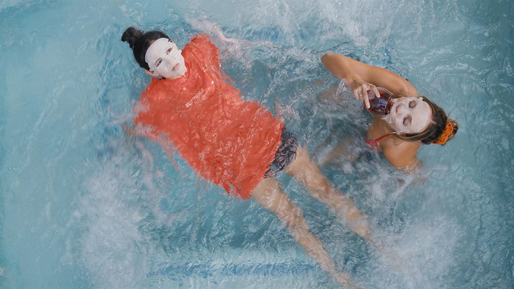 Vada (played by Jenna Ortega) and Mia (played Maddie Ziegler) lounge in the pool after finding comfort in their newly formed friendship. Photo courtesy of IMDb