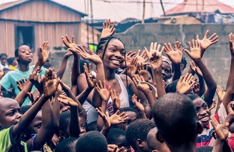 In 2018, Teni travelled to Nigeria to distribute care packages to people in need. Photo courtesy of Teni Bello