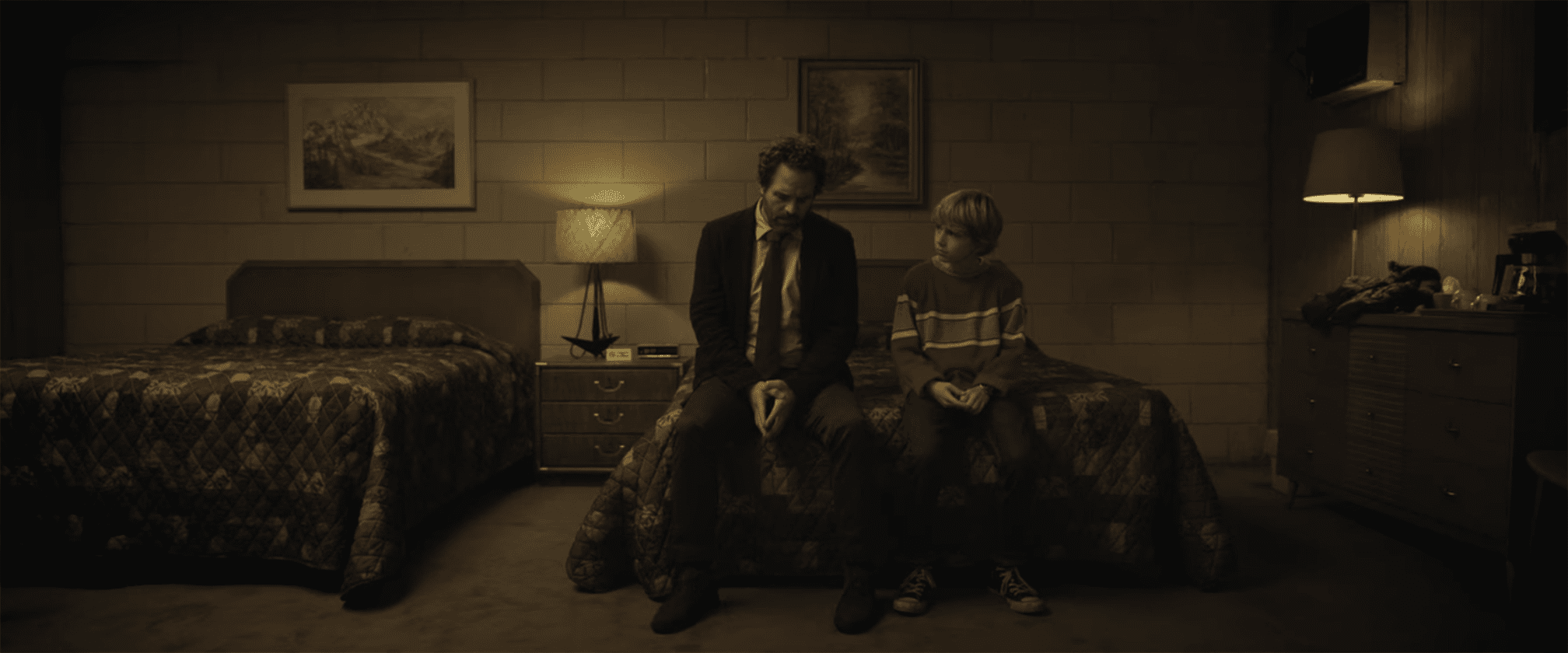 12-year-old Adam (Walker Scobell) comfort his father (Mark Ruffalo) Photo courtesy of Netflix.
