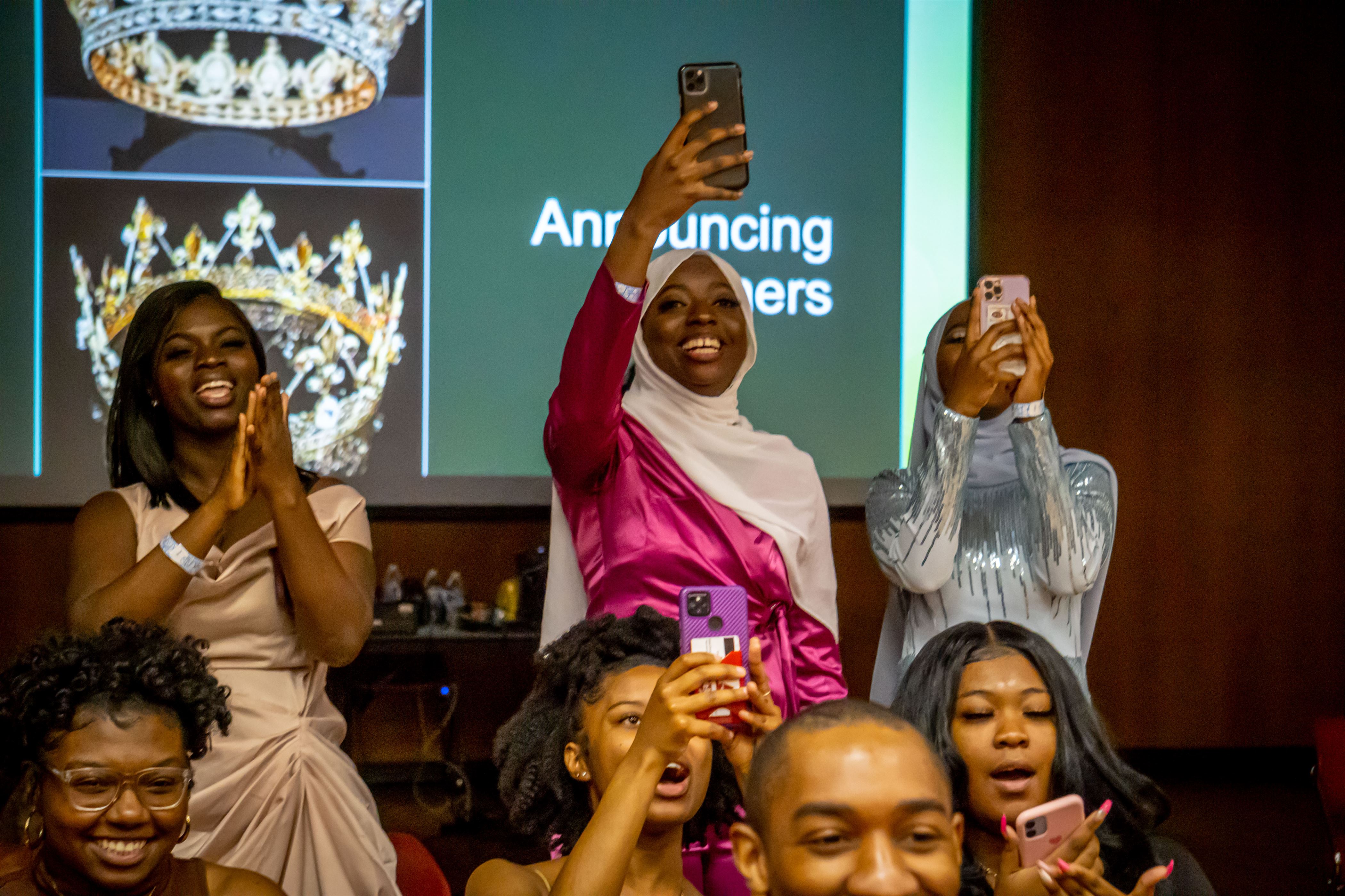 Fatoumata Amar's family cheer her on as she's crowned Mrs. NASO. Lynise Olivacce | The Montclrion