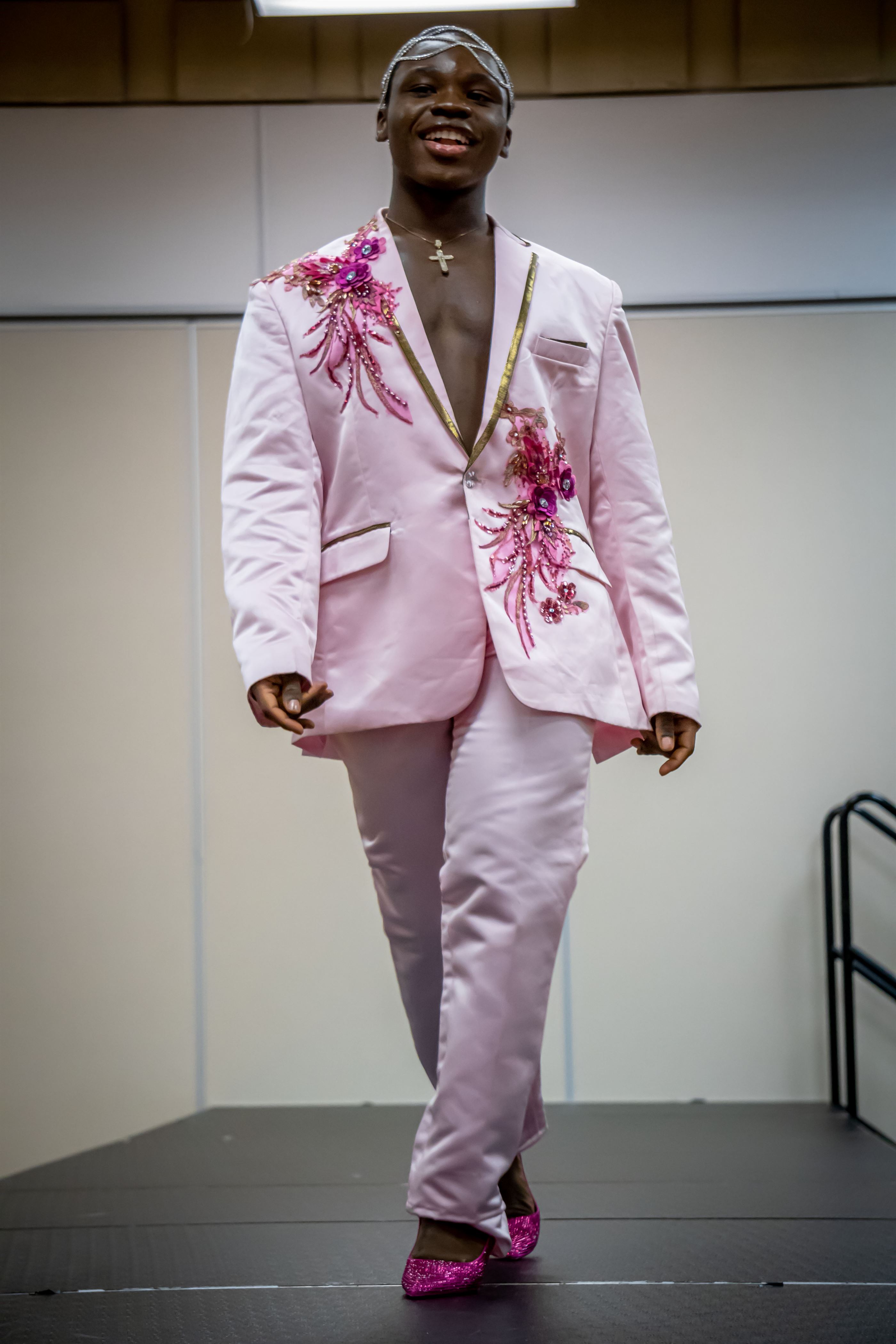 Tommy Robert, the new Mr. NASO and a sophomore fashion studies major, walks down the runway during the Formal category. Lynise Olivacce | The Montclarion