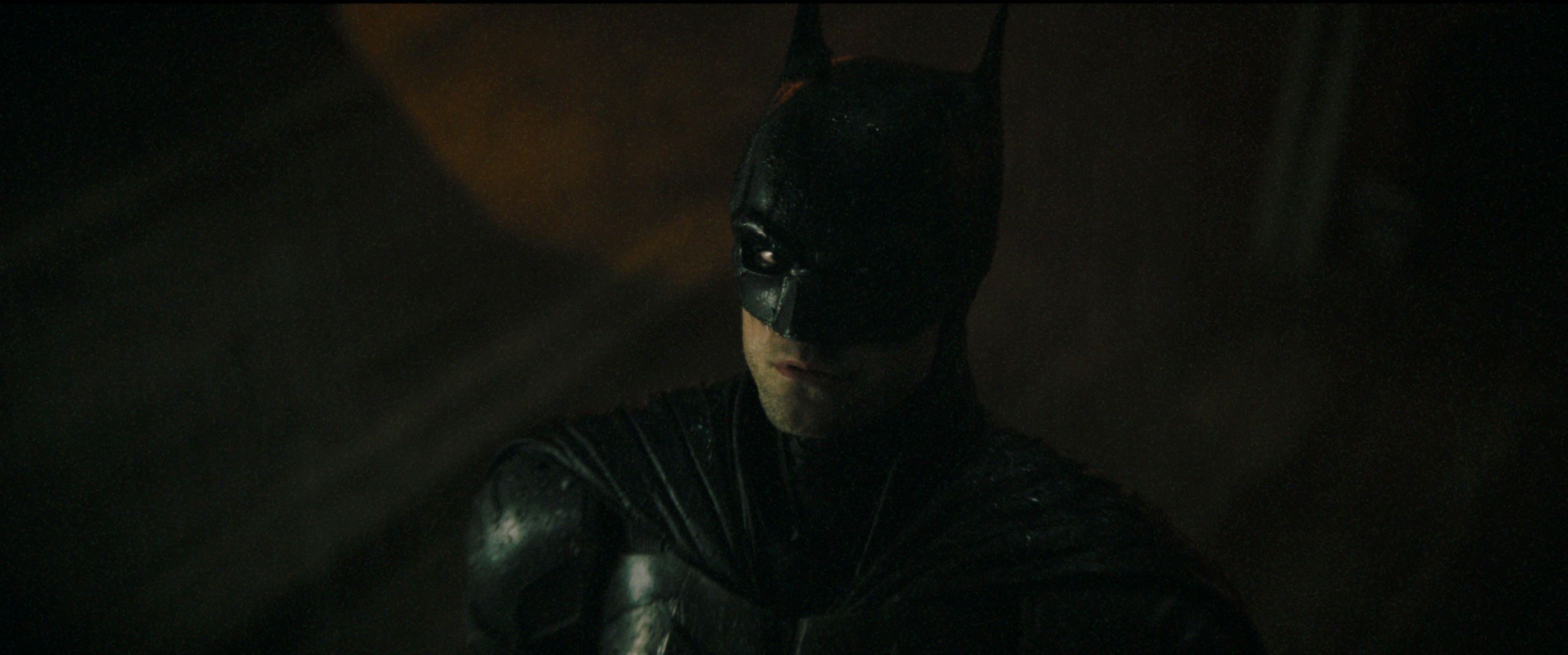 Batman (Robert Pattinson) sees the Bat-signal in the sky over Gotham. Photo courtesy of Warner Bros. Pictures