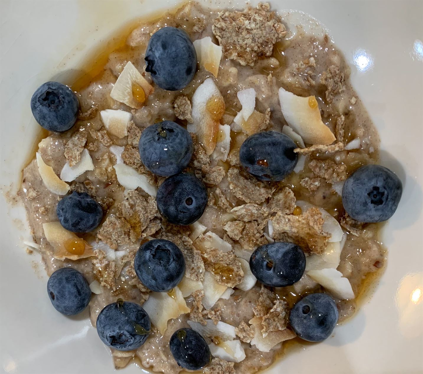 One of Gourmet Bailey's breakfast or dessert staples: oats, topped with cereal, berries, toasted coconut and maple syrup. Samantha Bailey | The Montclarion