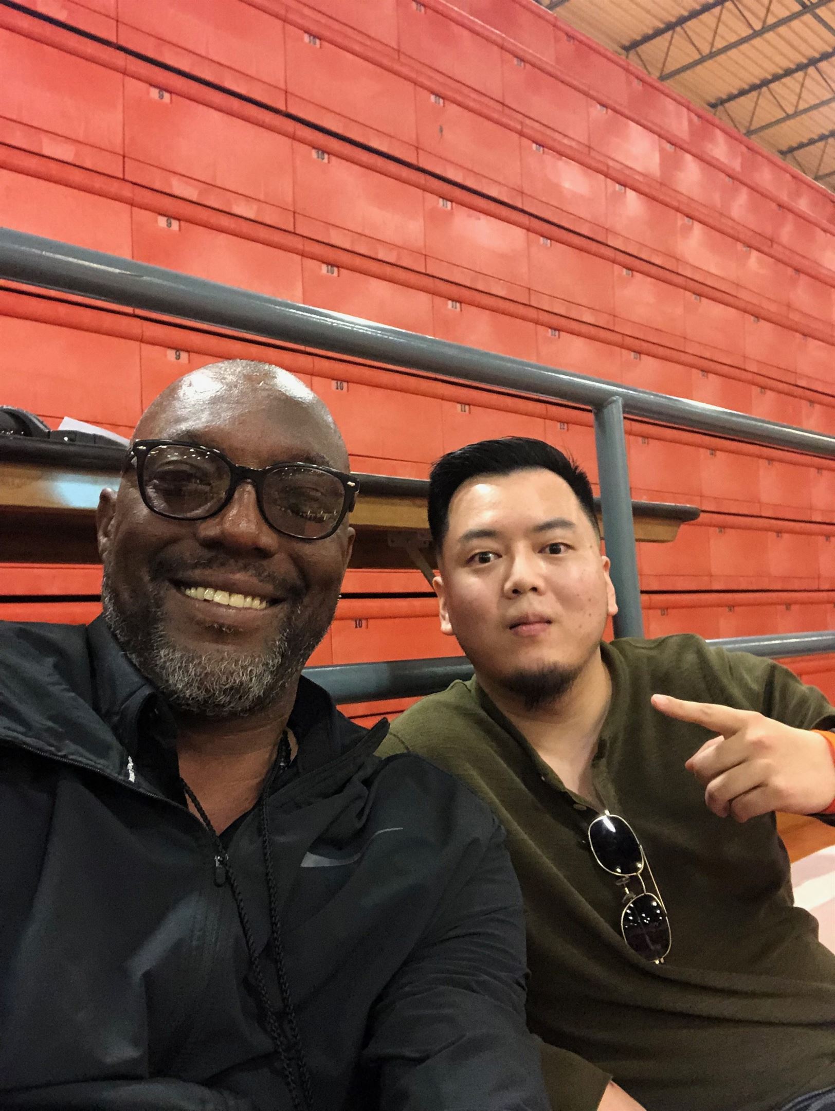 Henry Yeh is pictured alongside Keith Askins, former player of the Miami Heat and one of Yeh’s bosses. Photo courtesy of Henry Yeh