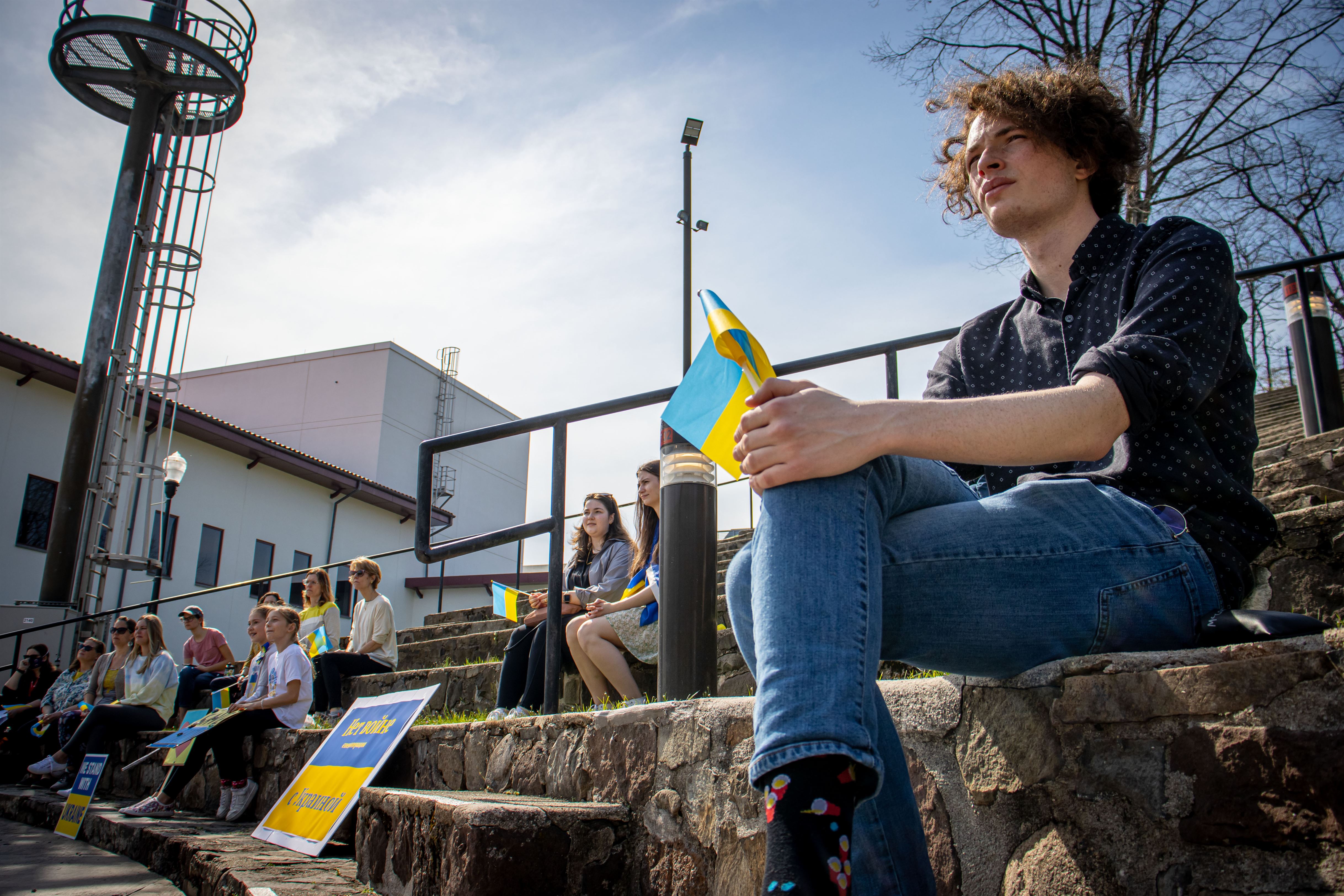 Jake Goetz, a junior film and television major, holds a Ukrainian flag in support of Ukraine. John LaRosa | The Montclarion