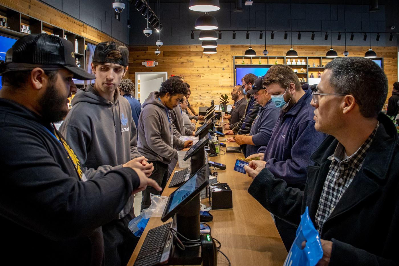 A line of costumers wrap around the multiple checkout desks inside the dispensary Ascend in Rochelle Park. John LaRosa | The Montclarion