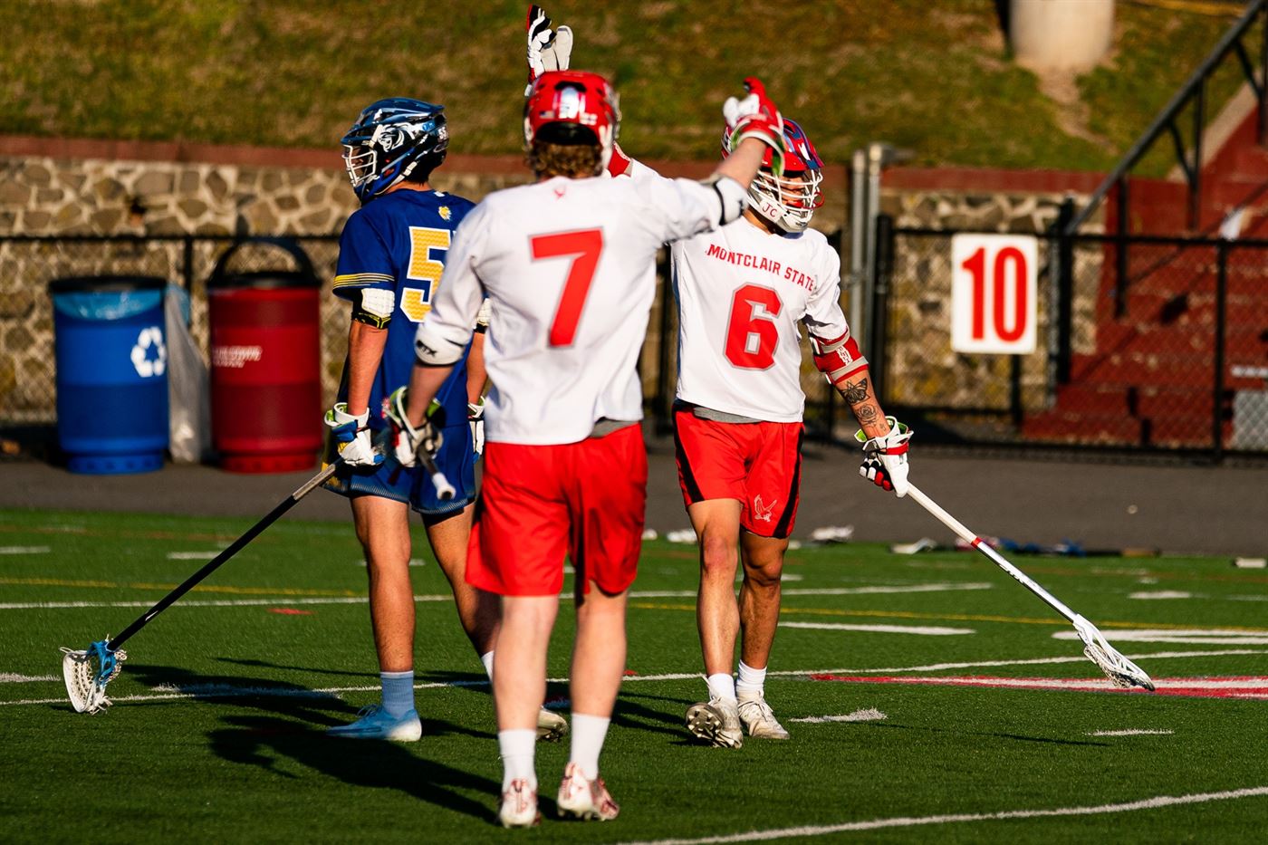 Boyle celebrates a goal scored by Joe Covino, who gave the senior attack his 100th point. Chris Krusberg | The Montclarion