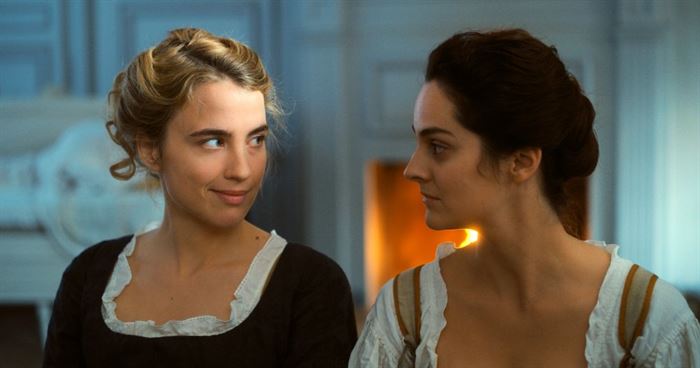 (Right to Left:) Marianne (Noémie Merlant) quickly becomes a friend to Héloïse (Adèle Haenel) as she paints her in secret in "Portrait of a Lady on Fire." Photo courtesy of Pyramide Films
