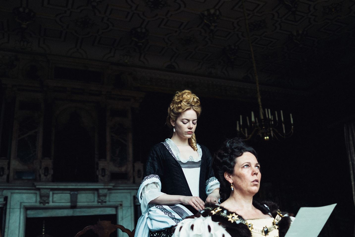 Emma Stone (left) stars in "The Favourite" as Abigail Masham, who attempts to get in the good graces of Queen Anne, played by Olivia Colman (right). Photo courtesy of Twentieth Century Fox