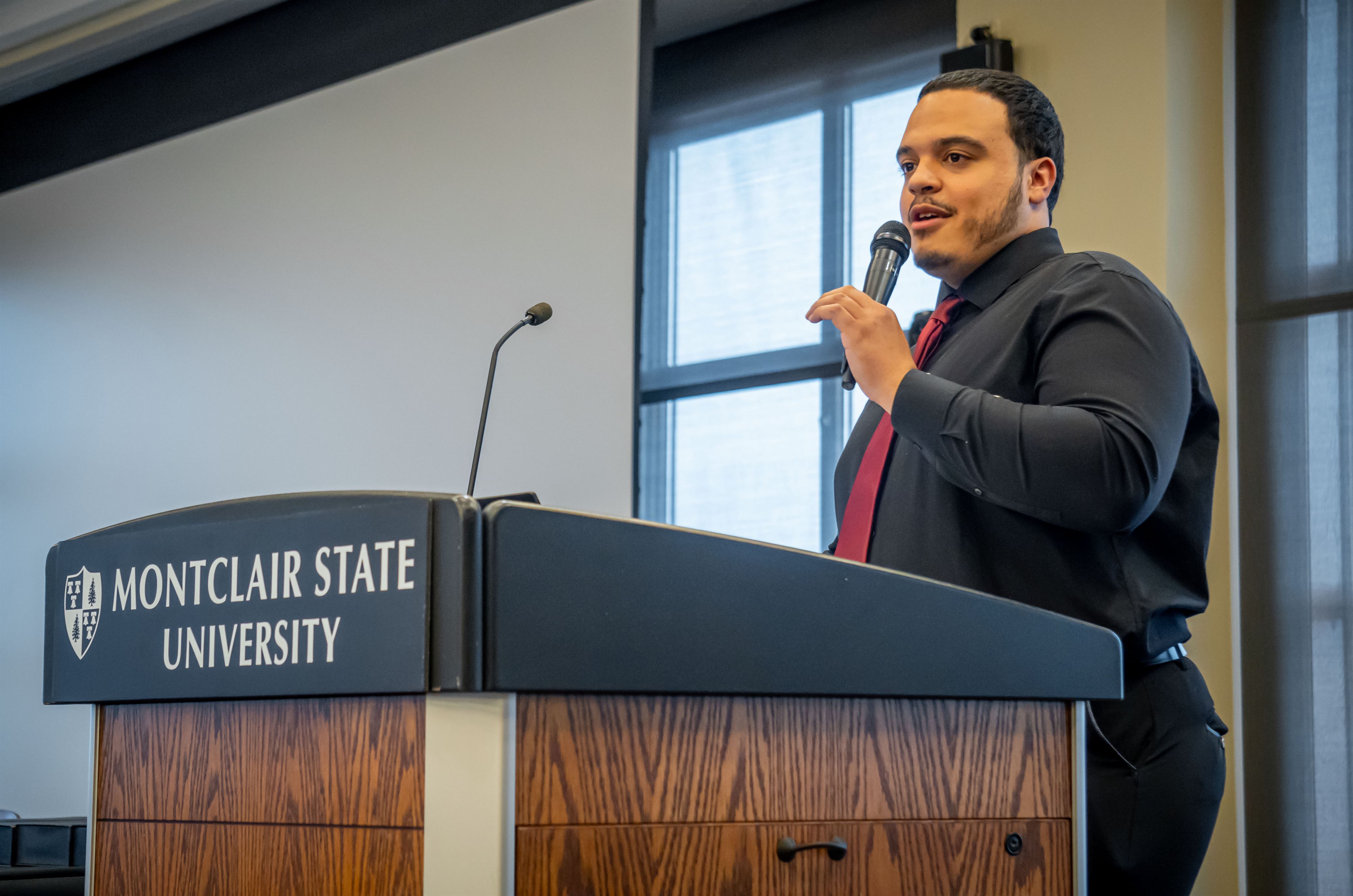 Ashon Lanada, the executive president of the SGA hosts the event and shares a few words. Lynise Olivacce | The Montclarion