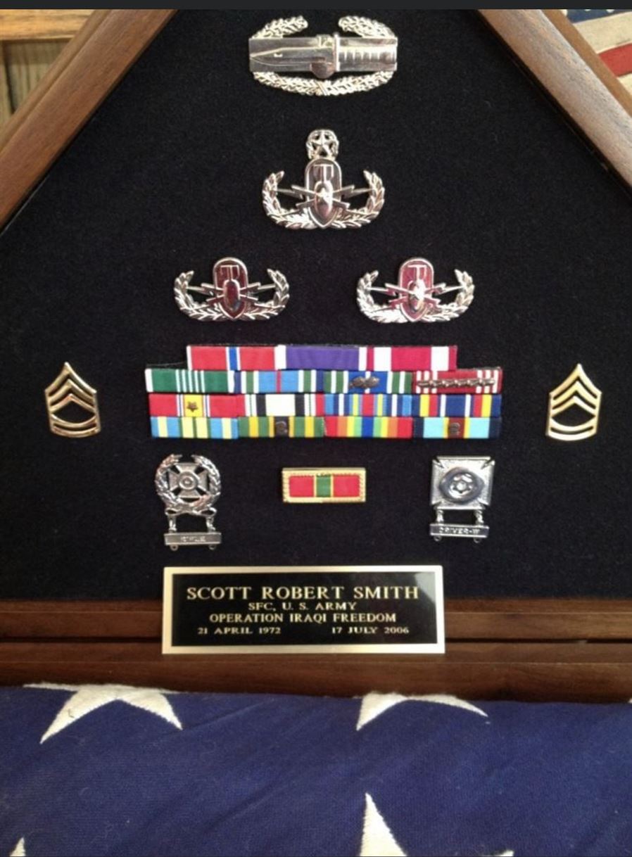 The memorial case for Sgt. 1st Class Smith, showing his medals and badges. Photo courtesy of Garilynn Smith