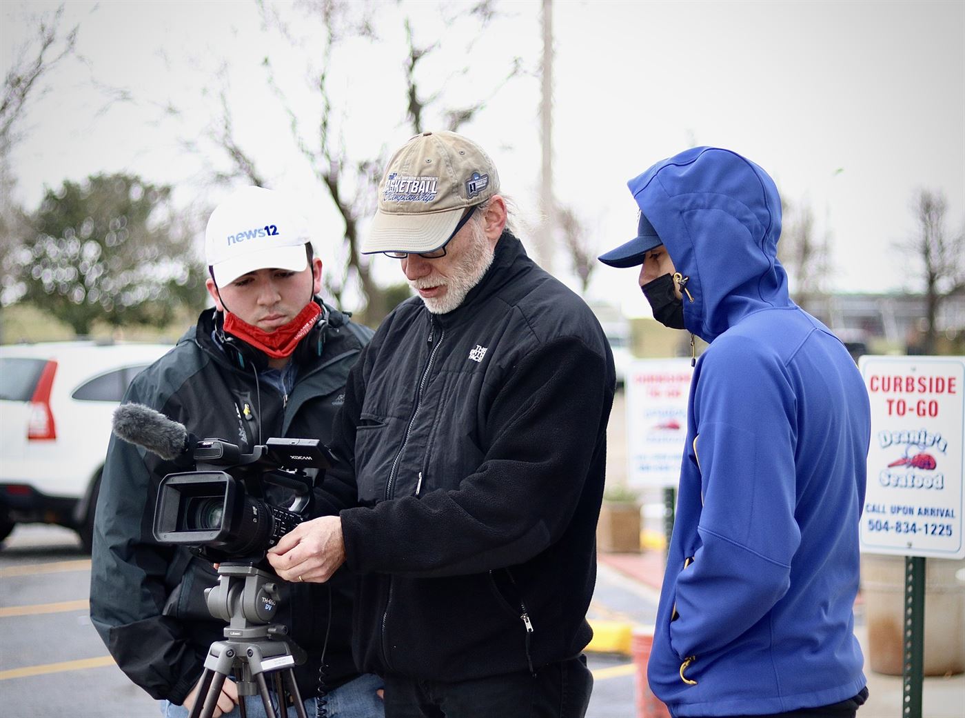 Professor McCarthy and two other students prepare their equipment for their shoot.