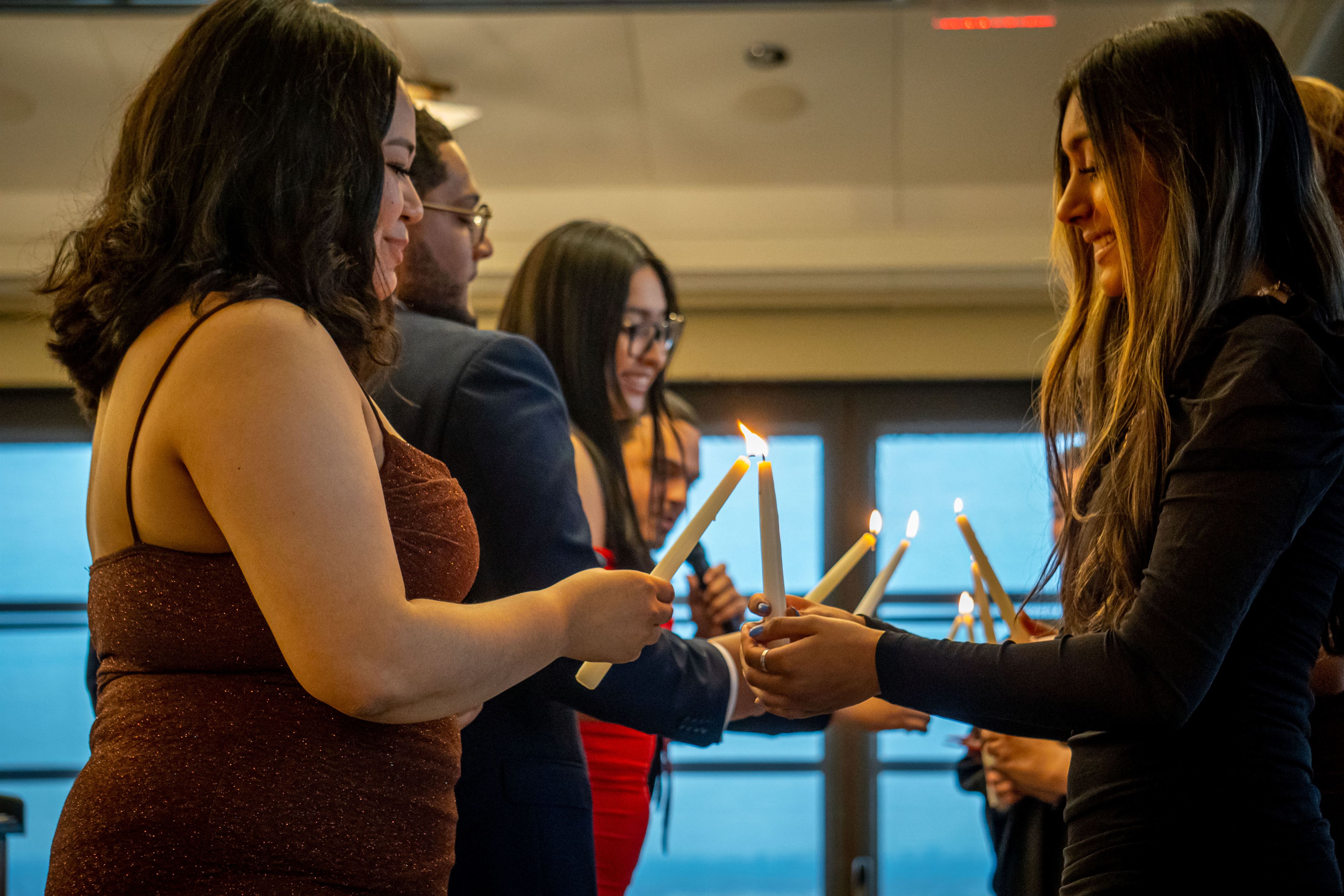 The SGA executive board lights the upcoming executive boards candles. Lynise Olivacce | The Montclarion