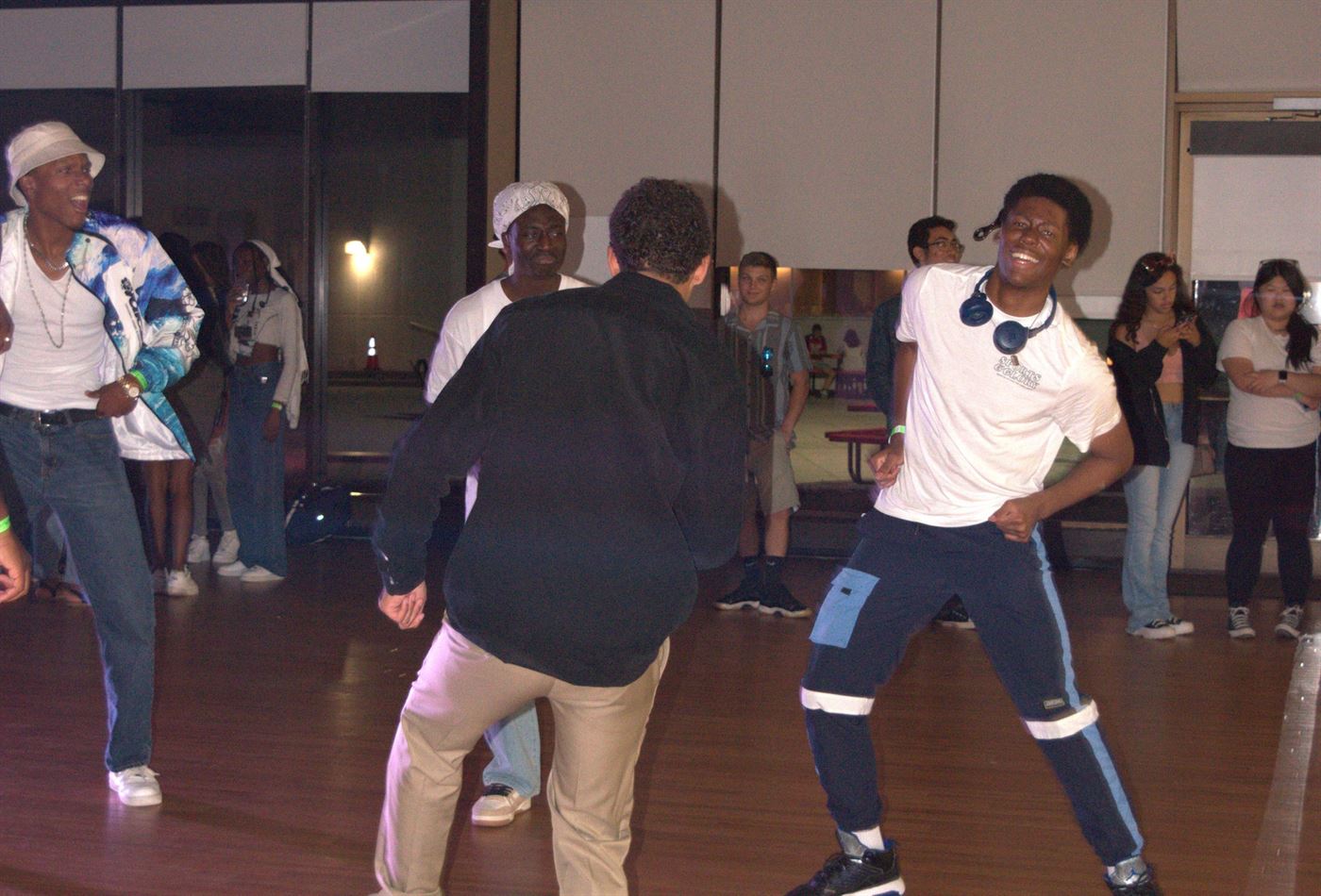 Tyler Tavernier (right) and friends dancing on the dance floor. Photo courtesy of Arely Reyes.