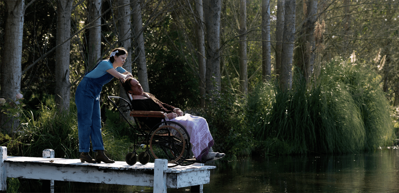 Pearl nudges her father’s wheelchair towards the edge of their alligator-infested lake.