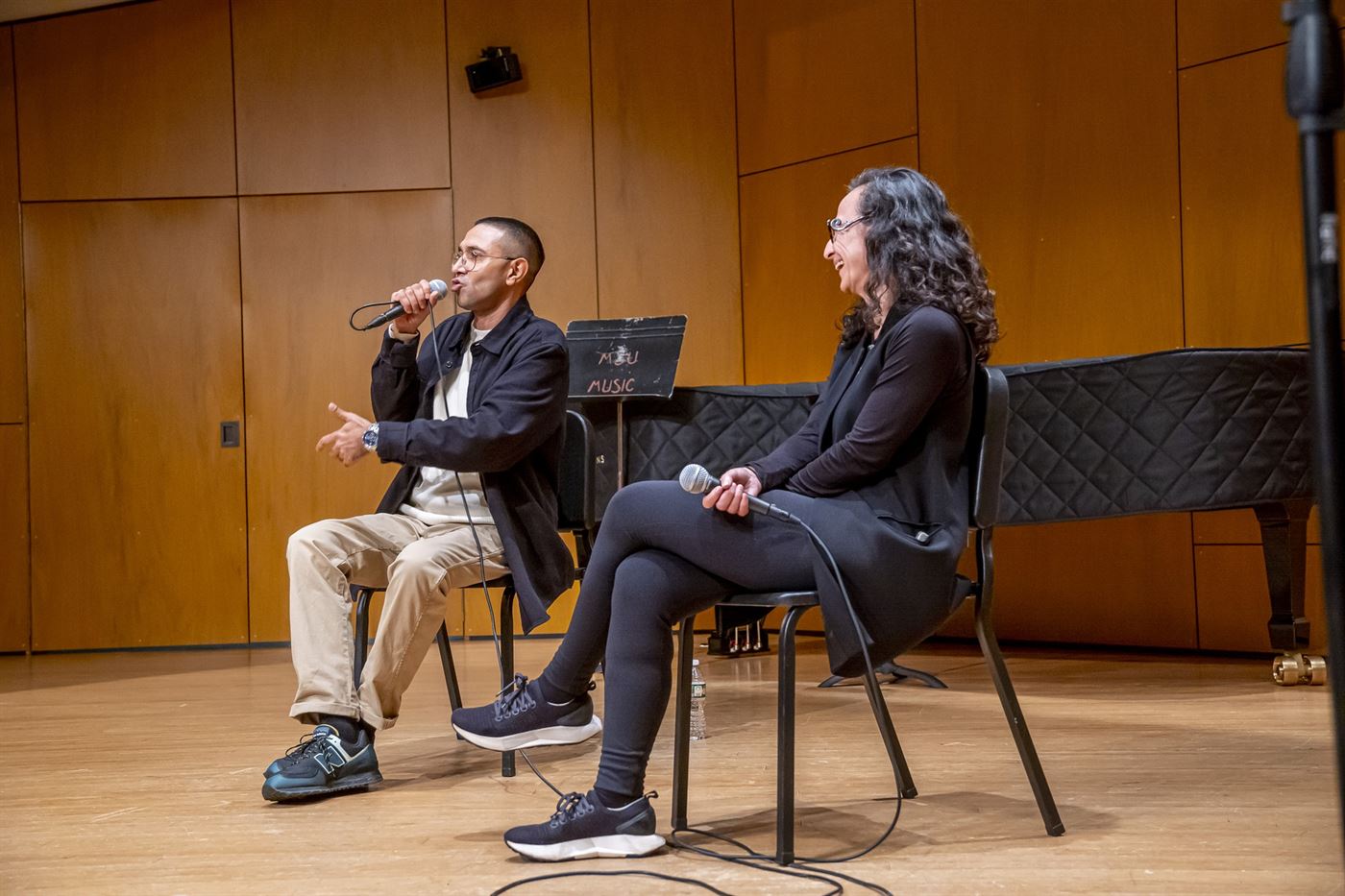 From left, Amir Issaa and Dr. Theresa Fiore, a professor of Italian and Inserra Chair in Italian and Italian American Studies, have a Q&A after Issaa's performance. Lynise Olivacce | The Montclarion