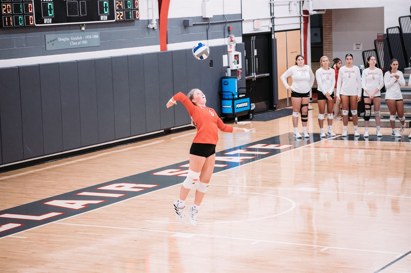 Emma Hatcher, leader in digs and service assists on the team, gets ready to serve the ball. Dan Dreisbach | The Montclarion