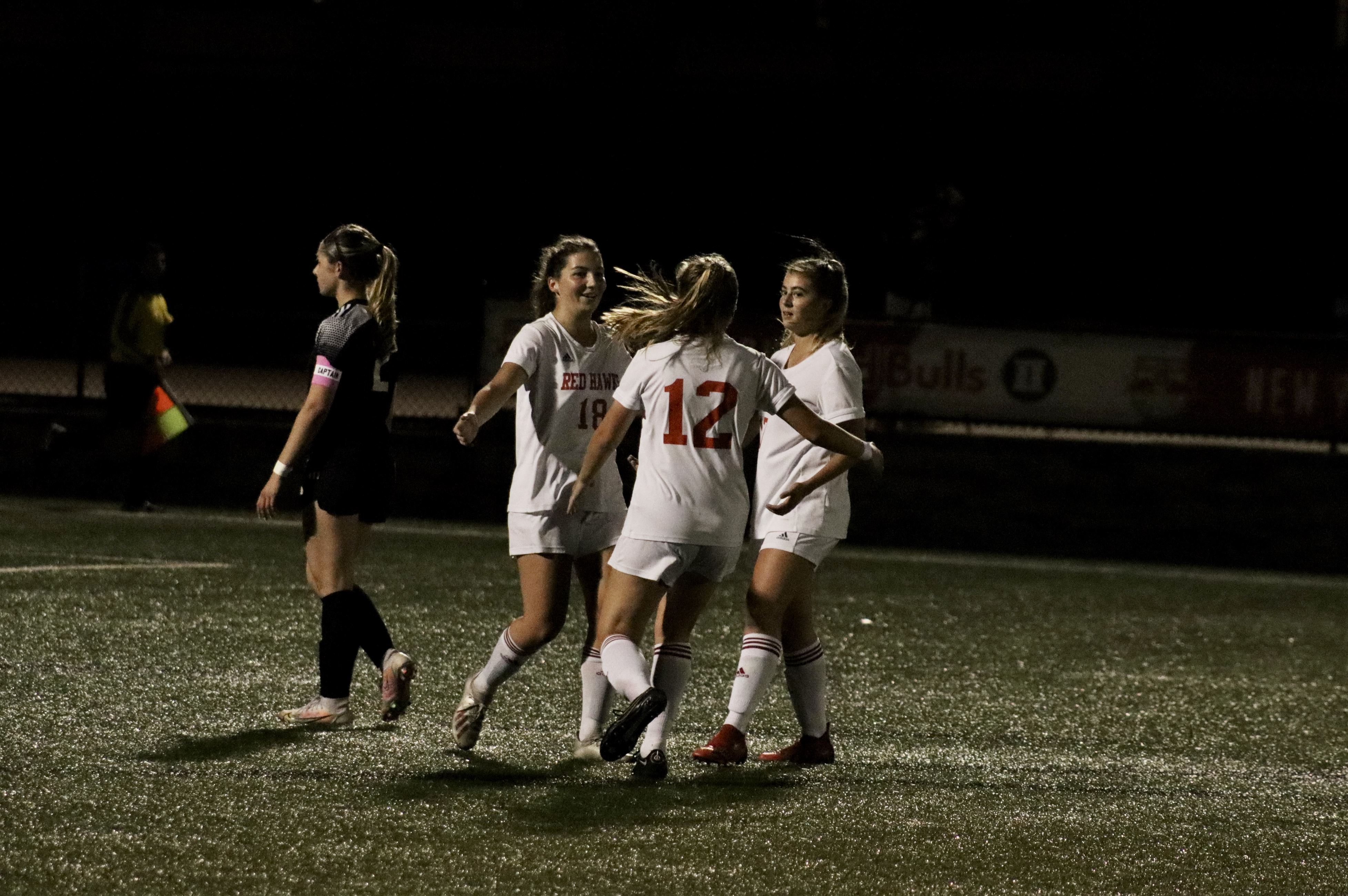 Aileen Cahill celebrates with her teammates as she scores one of her three goals of the night. Trevor Giesberg | The Montclarion