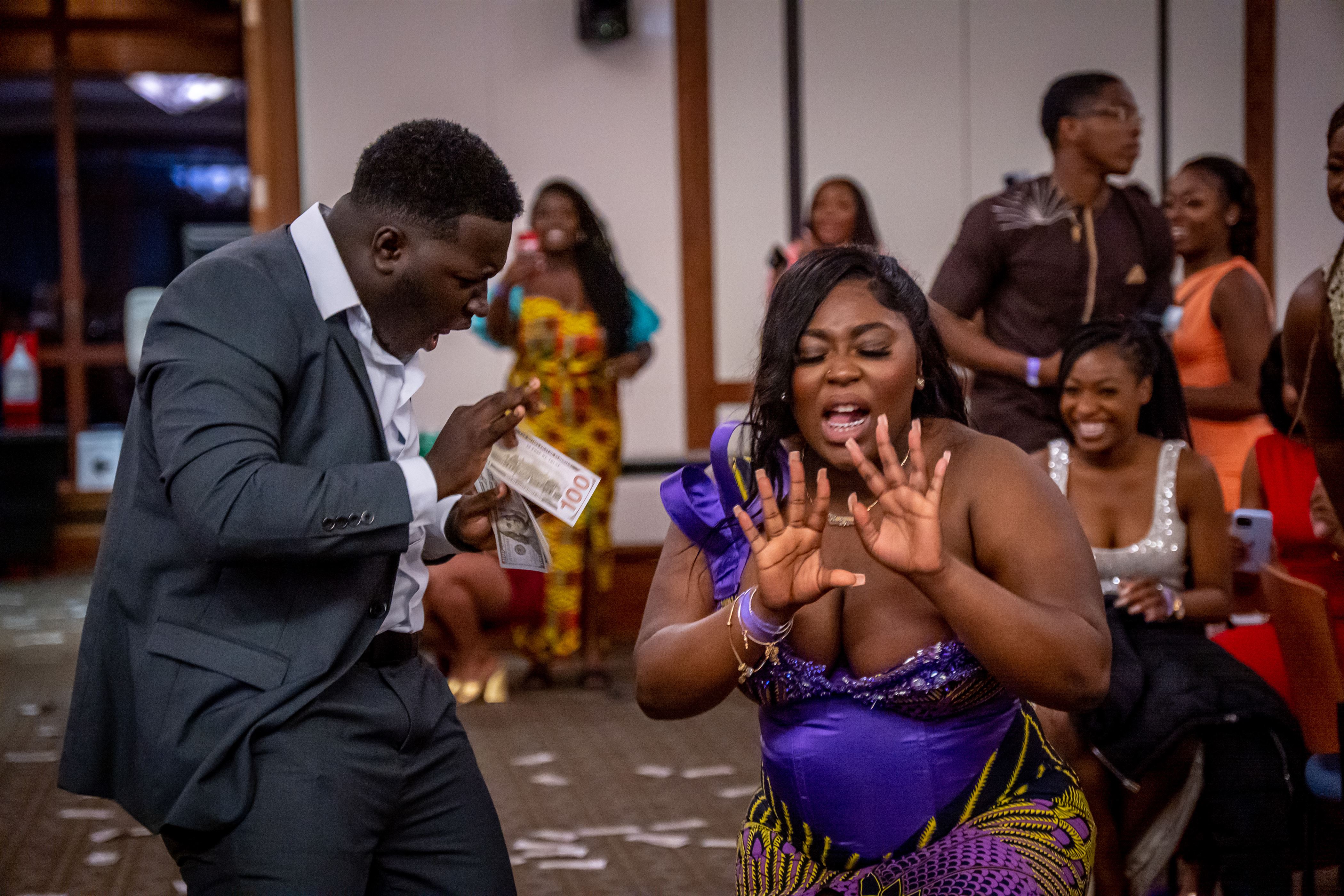 A bridesmaid and groomsman dance down the aisle in University Hall to Afrobeats. Lynise Olivacce. | The Montclarion