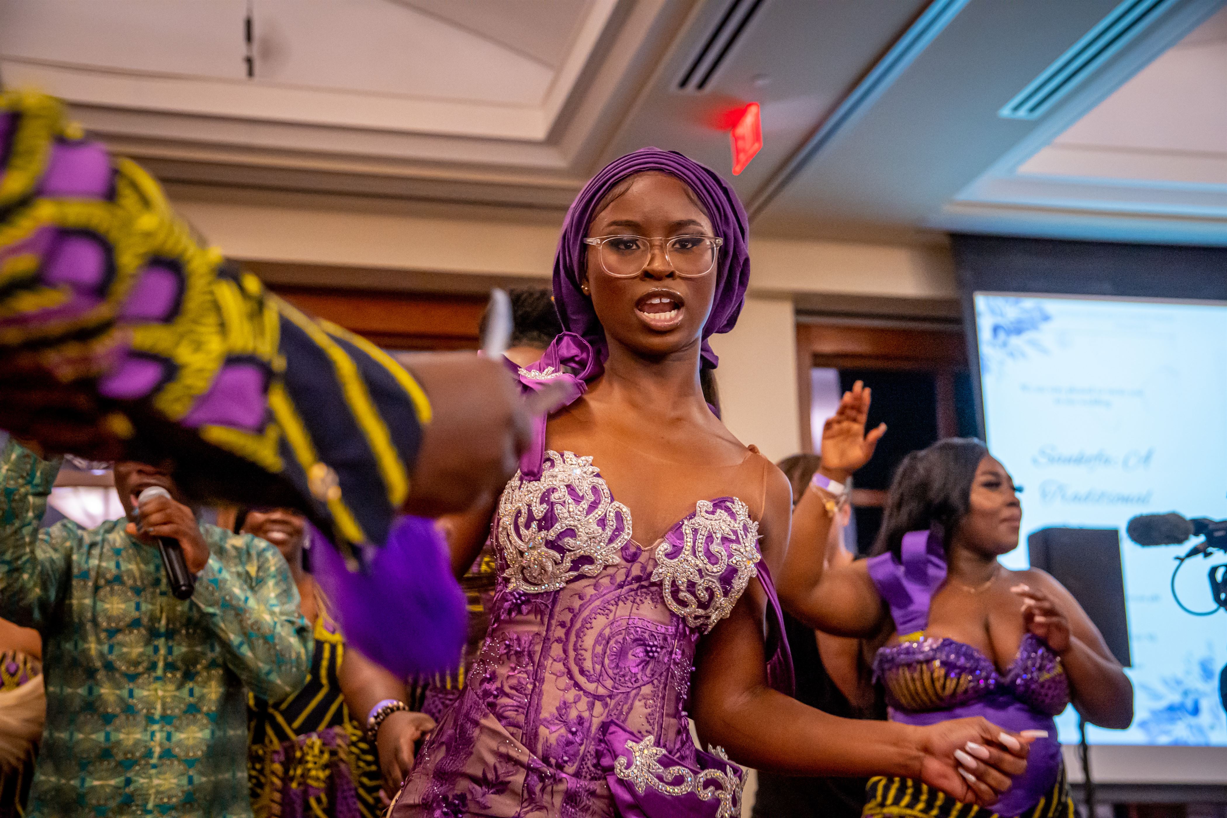Mary Olatunji dances on stage as she is revealed as the bride. 
Lynise Olivacce | The Montclarion