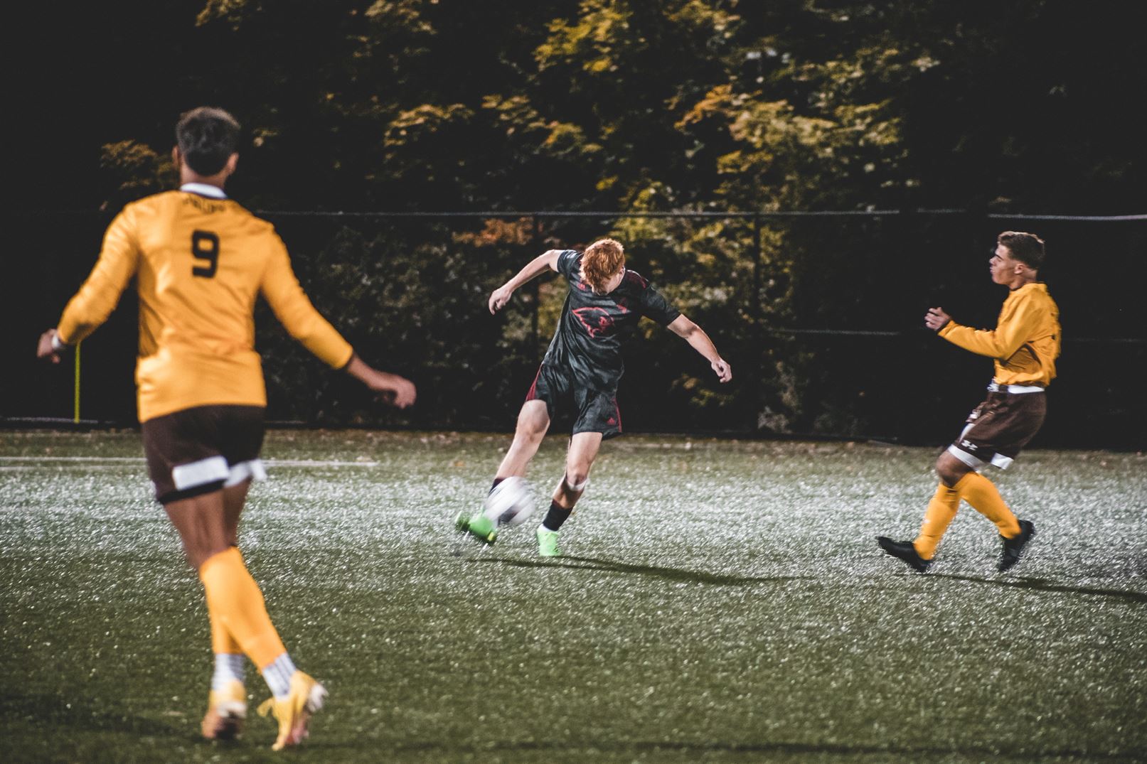 Ian Chesney looks to get past the defender and  kick the ball. Dan Dreisbach | The Montclarion