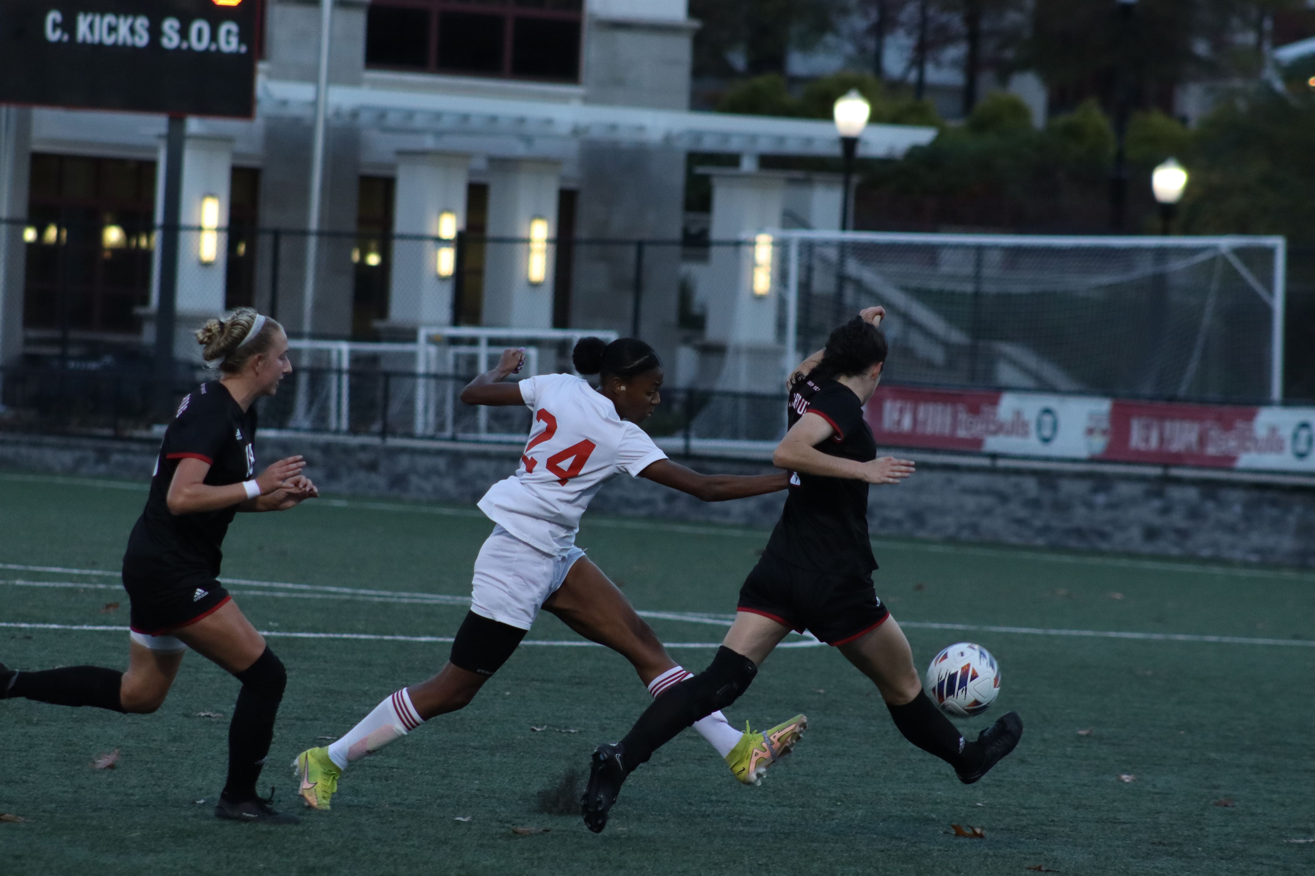 Kimberly Campbell attempts to steal the ball from a Lynchburg player. Trevor Giesberg | The Montclarion